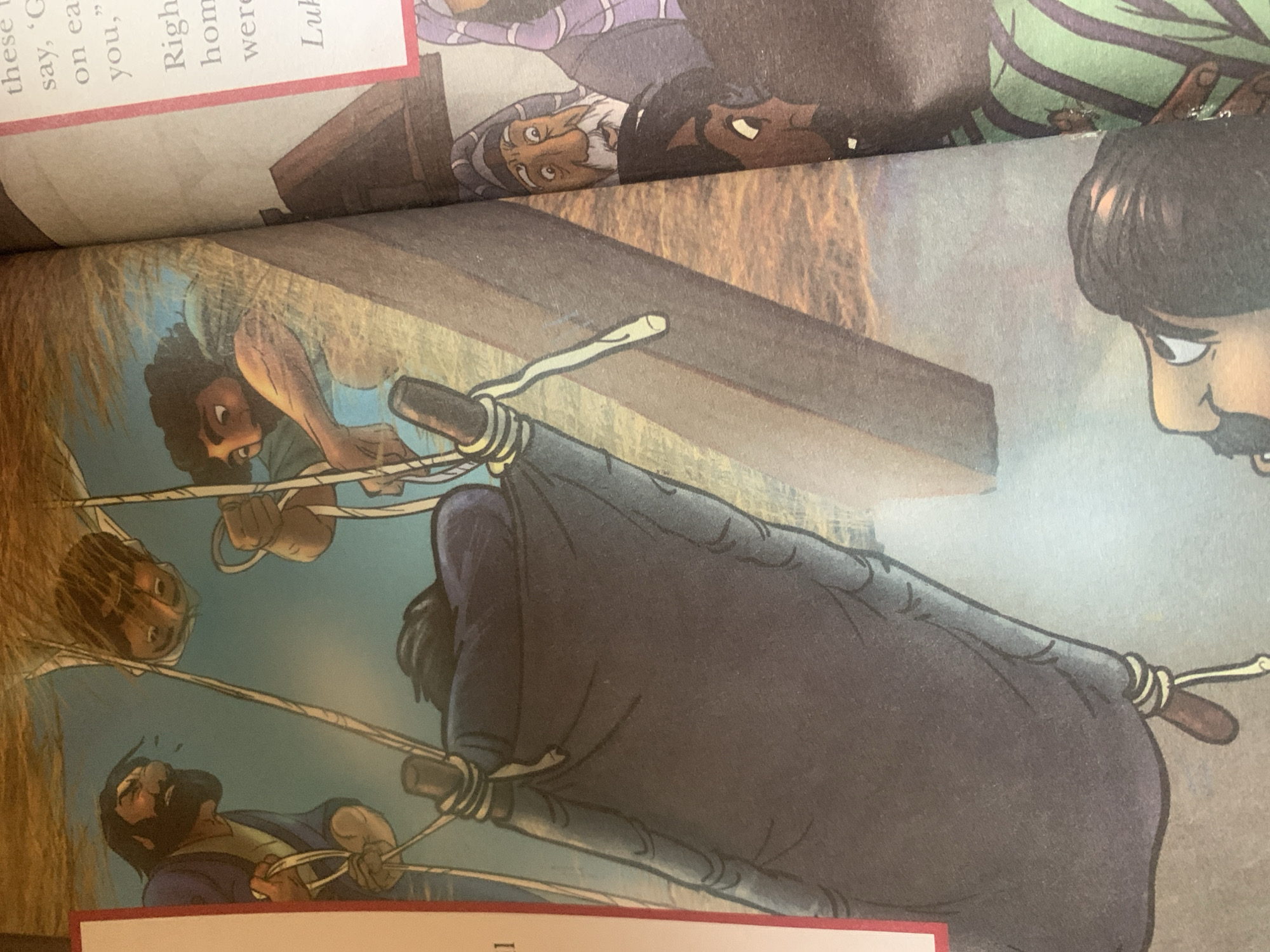 The image depicts a scene from a storybook, likely religious in nature, showing individuals lowering a person on a stretcher or mat. There are several men pulling on ropes attached to the stretcher, suggesting a coordinated effort to lower the individual. The setting appears to be outdoors, with a textured background that could represent a rough surface or landscape. The artistic style is illustrative, with bold outlines and bright colors. The text on the right side of the image contains what appears to be a passage from a scripture or religious text, mentioning "these", "say", "on ea", "you," "Righ", "hom", and "were", followed by "Luk". There is no information within the image or the provided context that indicates a location in Jauro Yinu, Nigeria. The image is a depiction of an event, not a photographic record of a specific place.