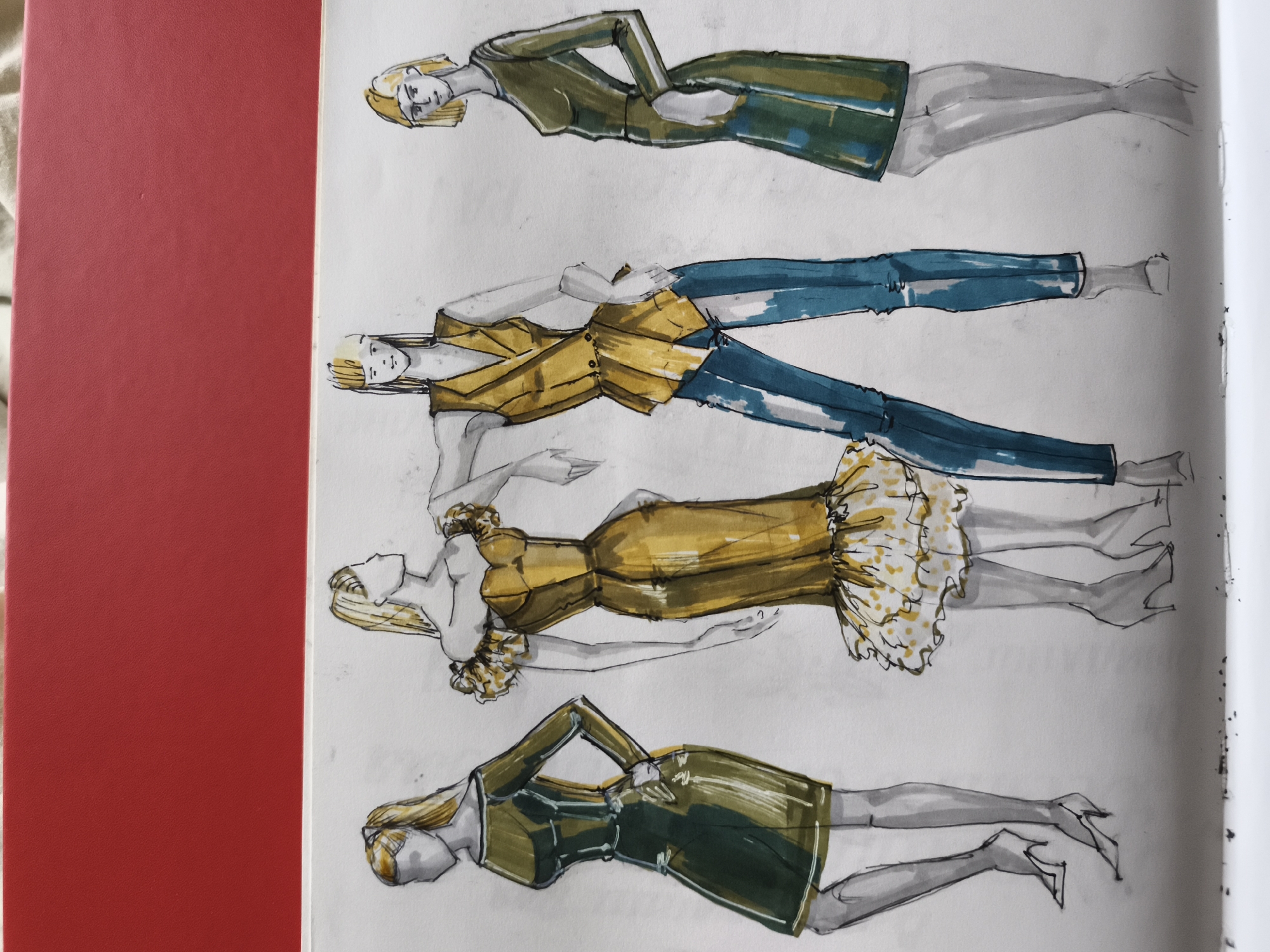The image is a fashion illustration of four female figures in varying poses, drawn with watercolor and ink on paper. The figures are depicted from head to toe and are arranged vertically.
The topmost figure wears a green dress with a gold belt. The second figure from the top is dressed in a gold top and blue jeans. The third figure is in a yellow dress with a ruffled hemline. The bottommost figure is wearing a dark green dress. All figures have blonde hair and are rendered with a sketched style, with visible brush strokes and line work. The background is plain white paper, with some smudges and ink bleeds visible, suggesting the artwork is in progress or has been handled. A red textured surface is visible on the left side of the image, obscuring a portion of the artwork. There are no indications of location within a city or any environmental context.