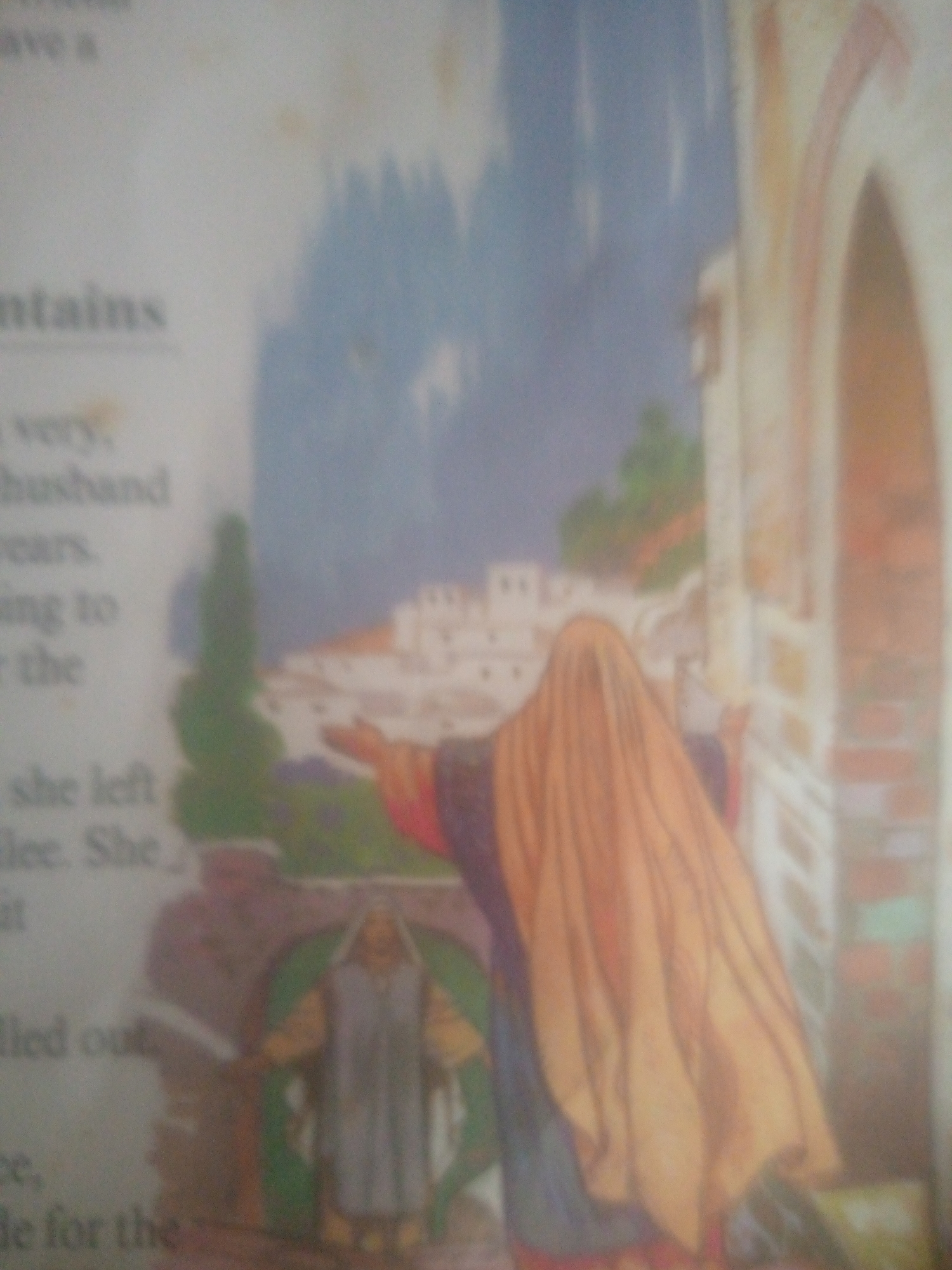 This is a photograph of an illustration, likely from a book. The illustration depicts a scene with a backdrop of mountains and buildings. In the foreground, a person is draped in a large, flowing orange cloth, obscuring their form and face. This person is reaching out towards the right side of the frame, where there is an architectural element with columns and arches. To the left of the draped figure, another person stands, wearing a gray robe and yellow tunic, appearing to be part of the scene's narrative. The overall impression is a religious or historical narrative, possibly from a story or scripture. The lighting in the illustration appears to be soft, suggesting either dawn or dusk, or perhaps an indoor setting illuminated by diffused light. There is text visible on the left side of the photograph, which appears to be part of the book's content. The legible text includes phrases like "mountains," "very," "husband," "she left," and "led out," suggesting a narrative context involving travel, personal circumstances, and perhaps a journey. The image quality is somewhat blurred, making precise details difficult to discern.
