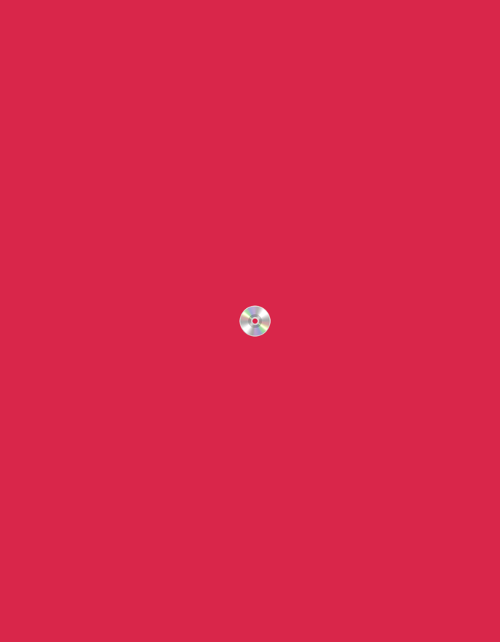 The image displays a single, small, silver CD that is centrally located against a plain red background. There are no other objects or people visible in the image. The CD is the only subject, and its placement appears to be deliberate due to its central position. There is no information or context provided within the image to suggest a specific location in Moscow, Russia, or any other geographical area.