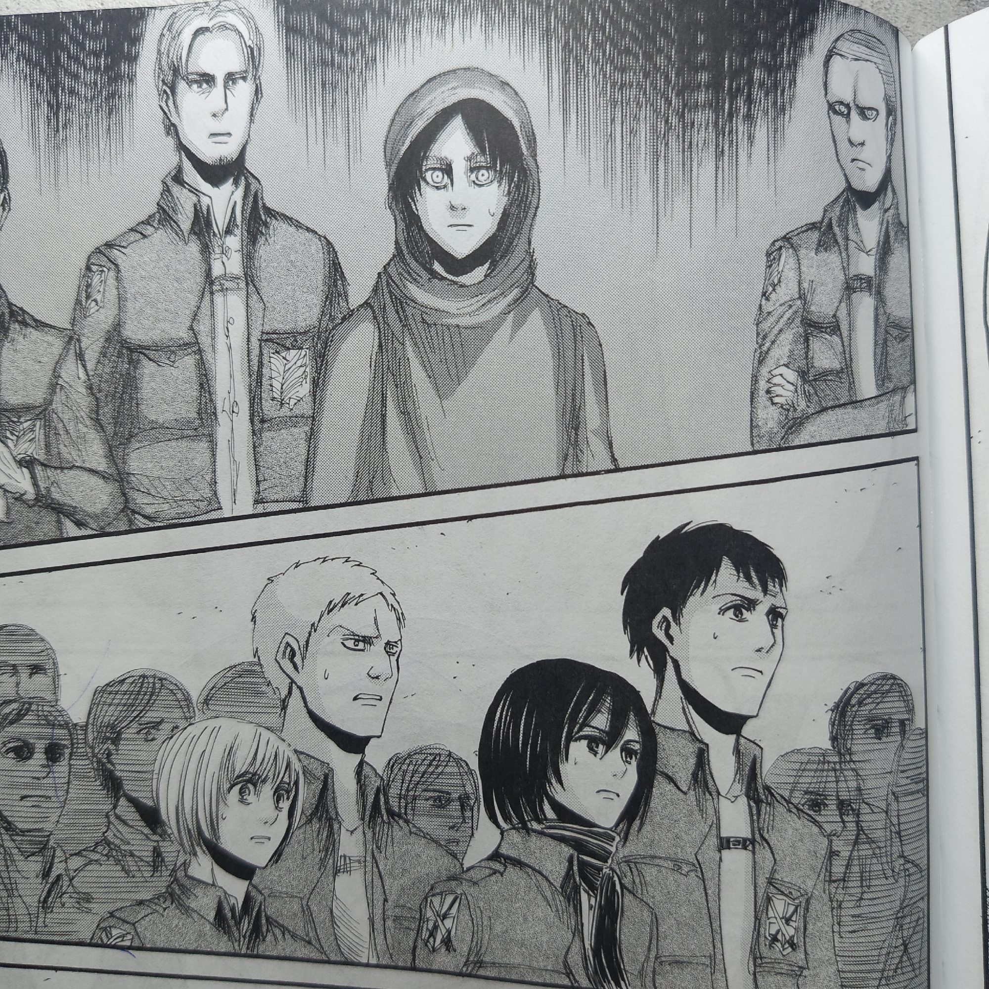The image is a panel from a manga, featuring two separate scenes. The upper scene depicts three characters in a formal setting with dark, rain-like lines in the background. The character on the left has light hair and a serious expression. The central character is wearing a hooded garment, their eyes wide and focused. The character on the right also has light hair and a stern expression.
The lower scene shows a larger group of characters, several of whom are only partially visible. In the foreground, a character with short, blonde hair looks distressed. Next to them is a character with a worried expression and light hair. A character with dark hair and a scarf stands next to a character with dark hair. All visible characters are wearing similar military-style uniforms.