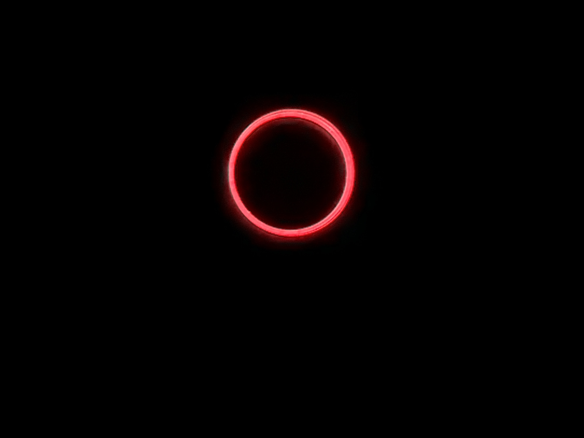 A red neon ring is centered on a black background. No specific location information regarding Naberezhnye Chelny, Russia, is present.