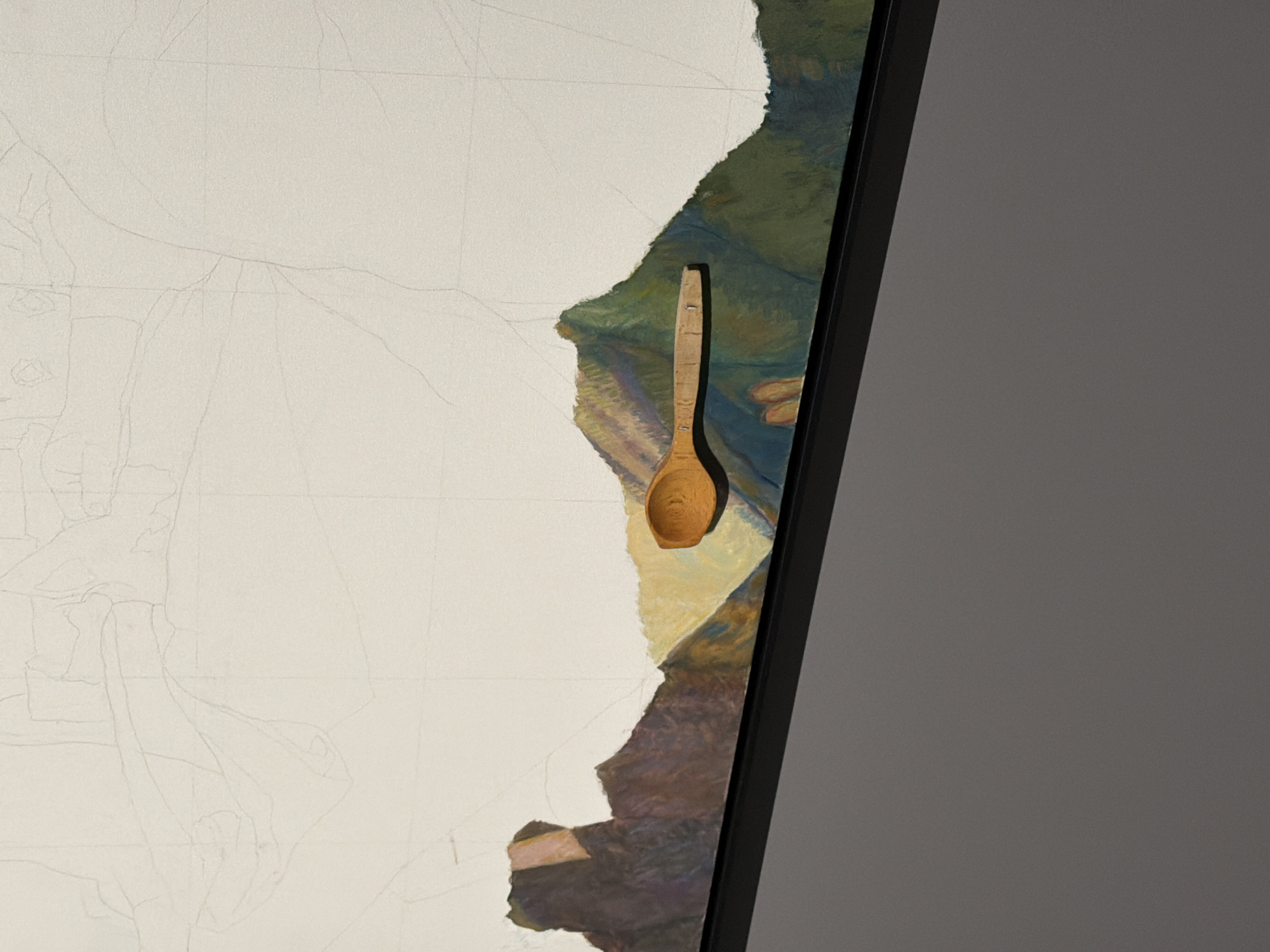 The image shows a close-up, oblique view of a framed artwork on a gray wall. The artwork itself is a mixed-media piece, featuring a large section of blank canvas with faint pencil sketches of figures and drapery, juxtaposed with a painted area. The painted section depicts a landscape with dark, earthy tones and patches of green and yellow, suggesting hills or fields.
A prominent element in the painting is a small, carved wooden spoon affixed to the surface. The spoon is oriented vertically, with its bowl facing upwards and slightly to the right. It appears to have small indentations or markings along its handle, possibly indicating measurements or a decorative pattern.
The transition between the sketched and painted areas is abrupt, creating a textured edge that reveals the layered nature of the artwork. The overall impression is that of a work in progress or an experimental piece, integrating physical objects into a two-dimensional composition. The lighting is soft and diffused, casting subtle shadows that add depth to the spoon and the painted textures. There is no visible text in the image.