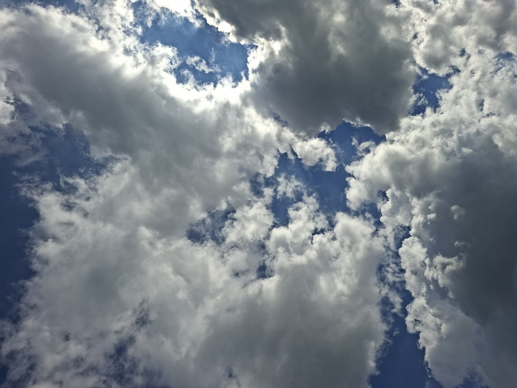 A view of the sky in Galabovo, Bulgaria, filled with a combination of white and grey cumulus clouds against a blue sky. The clouds cover most of the sky, with patches of blue visible between them. The lighting suggests it is daytime.