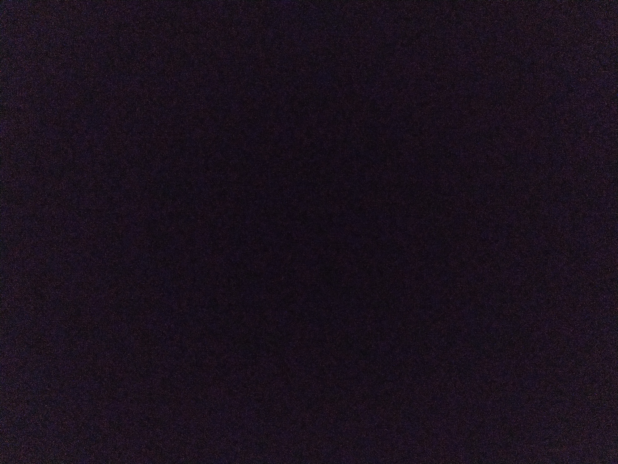 The image is a very dark, indistinct photograph with significant noise. It's difficult to discern any specific details or content within the image. There's no visible information to determine a location, people, objects, actions, or interactions. It appears to be a very low-light or underexposed image of an unidentifiable subject.