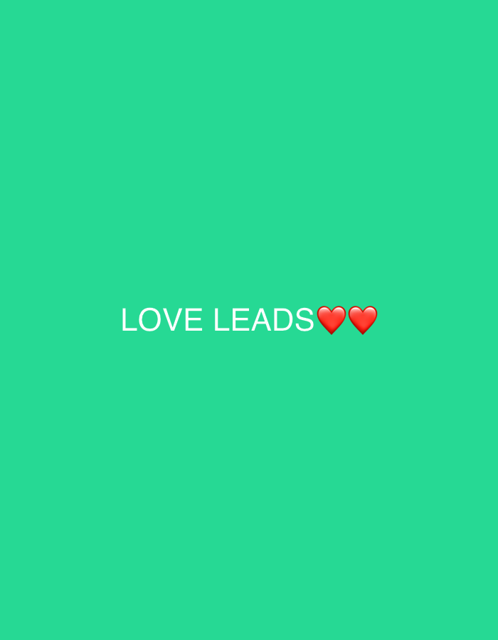 A light green background features the white text "LOVE LEADS" centered. Two red heart emojis follow the words, spaced closely together. The text and hearts are positioned near the middle of the image. The overall impression is simple and positive, conveying a message about the power of love.