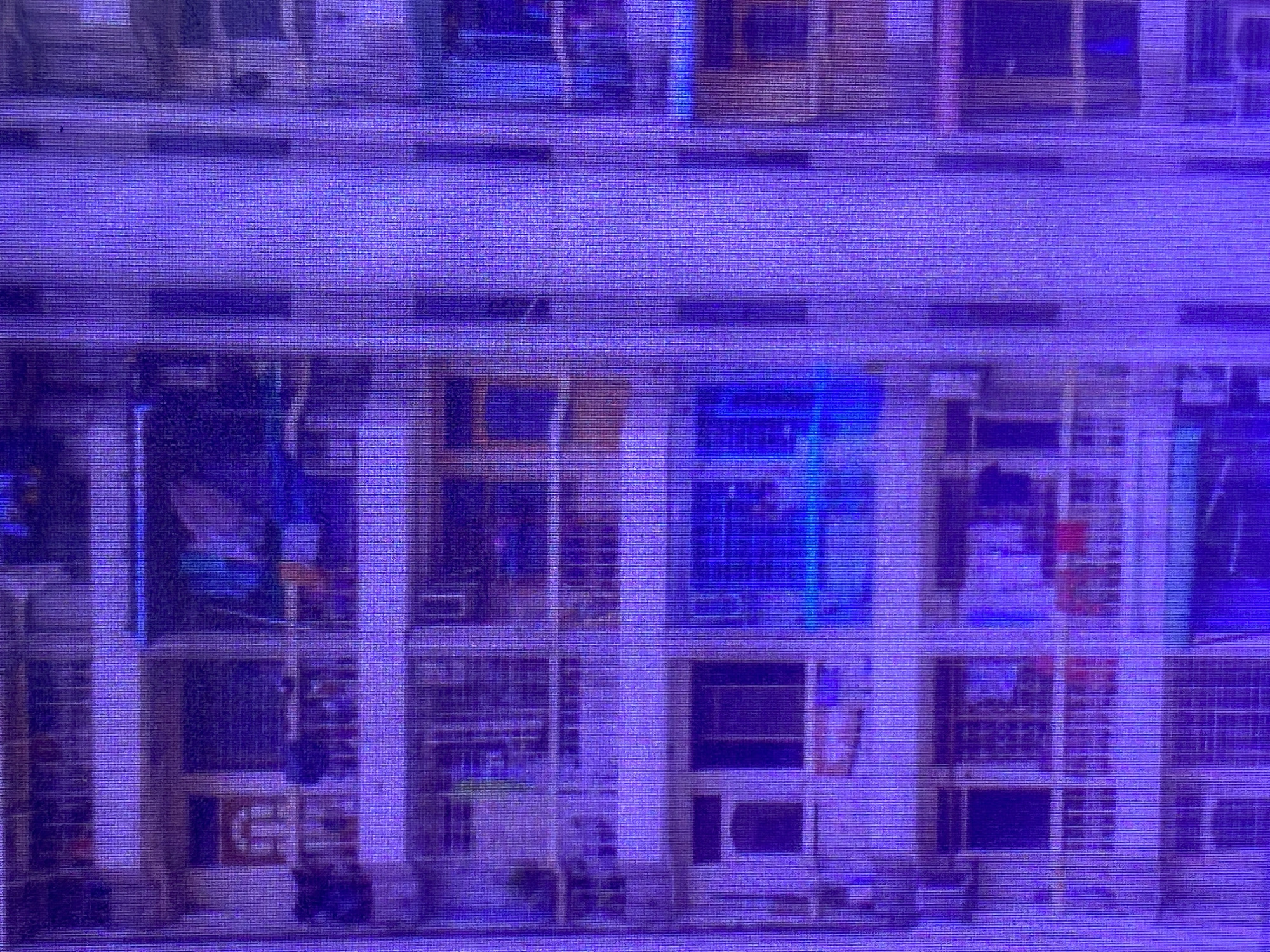 The image displays a purple-hued, pixelated view of a building, likely an apartment or office complex, with multiple windows arranged in rows. The scene is abstract due to the strong purple filter and the grainy texture of the image, which might be a result of digital noise or an artistic effect.
Within the numerous windows, some appear to contain reflections or internal lighting, creating areas of brighter blue and white. In some of the windows, there are vague shapes that could suggest objects, furniture, or even silhouettes of people. The overall impression is of a large building with many individual units.
There are no clear indications of time of day or weather conditions. The setting is not precisely identifiable beyond it being a multi-story building. No specific activities are discernible, though the presence of internal lights and potential objects within the windows hints at occupancy. No visible text is present in the image. The purple filter gives the scene a somewhat surreal or stylized appearance.