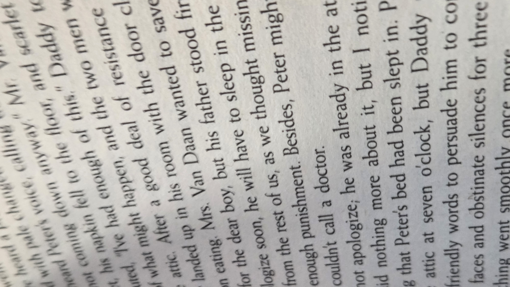 This is a close-up, angled, slightly blurred photograph of text printed on white paper. The text is in English and is arranged in lines. The image captures a section of a book or document. No people, objects, or environmental details related to Margajaya, Indonesia are present. The photograph is solely focused on the printed text.