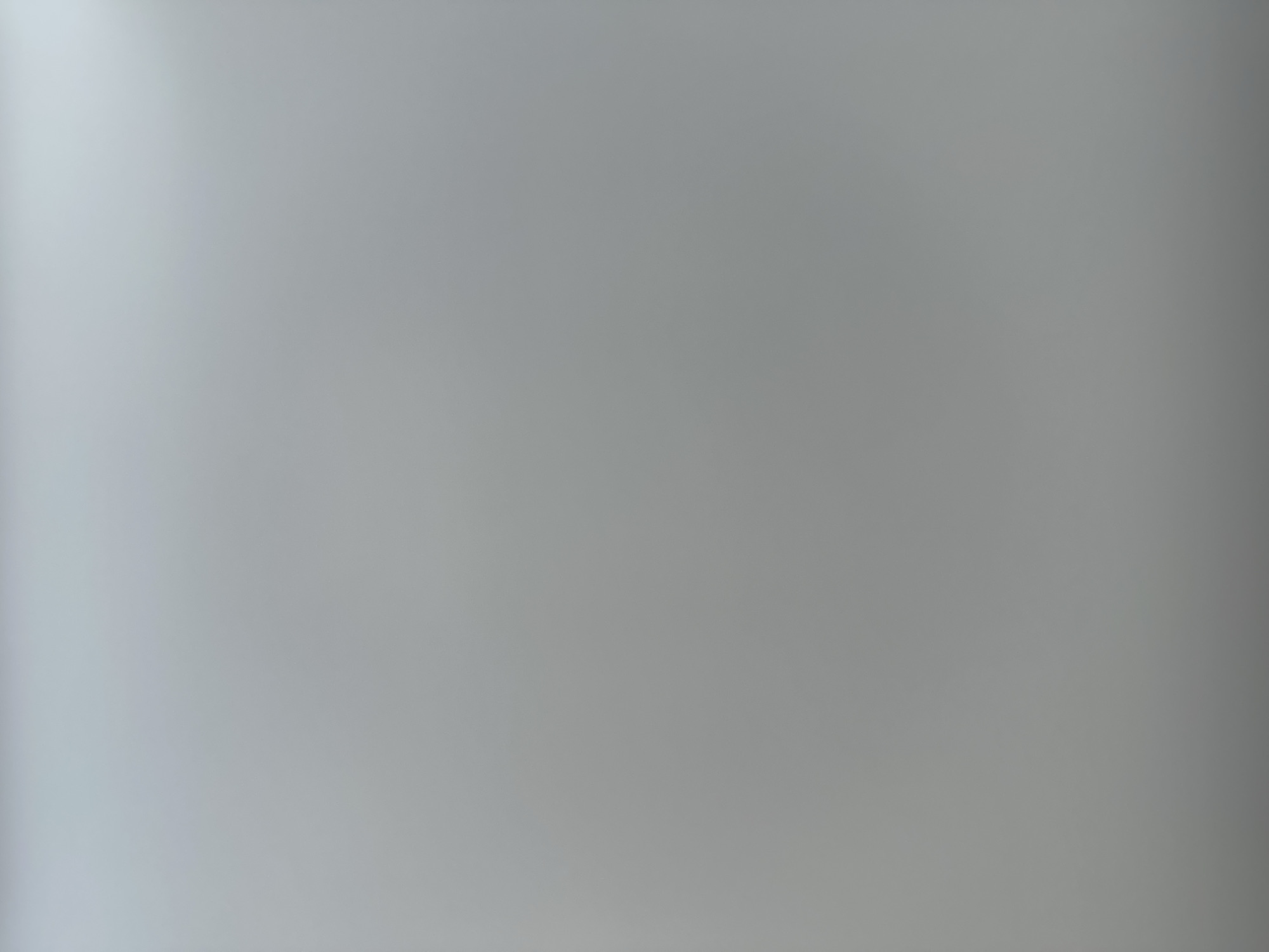 This is a blurry, out-of-focus image of a gradient of gray. There are no discernible people, subjects, objects, actions, or interactions. The image is not representative of any specific location in the city of Belgrade, Serbia.
