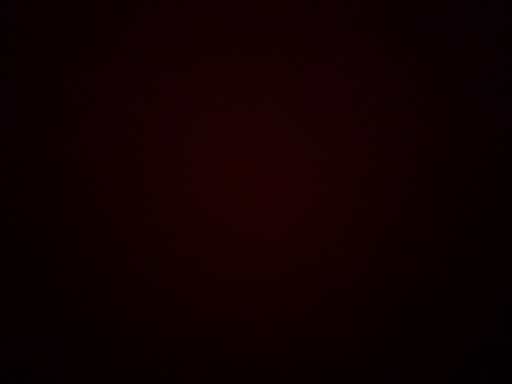 The image is completely dark, making it impossible to discern any details. It is not possible to provide a description of the scene.