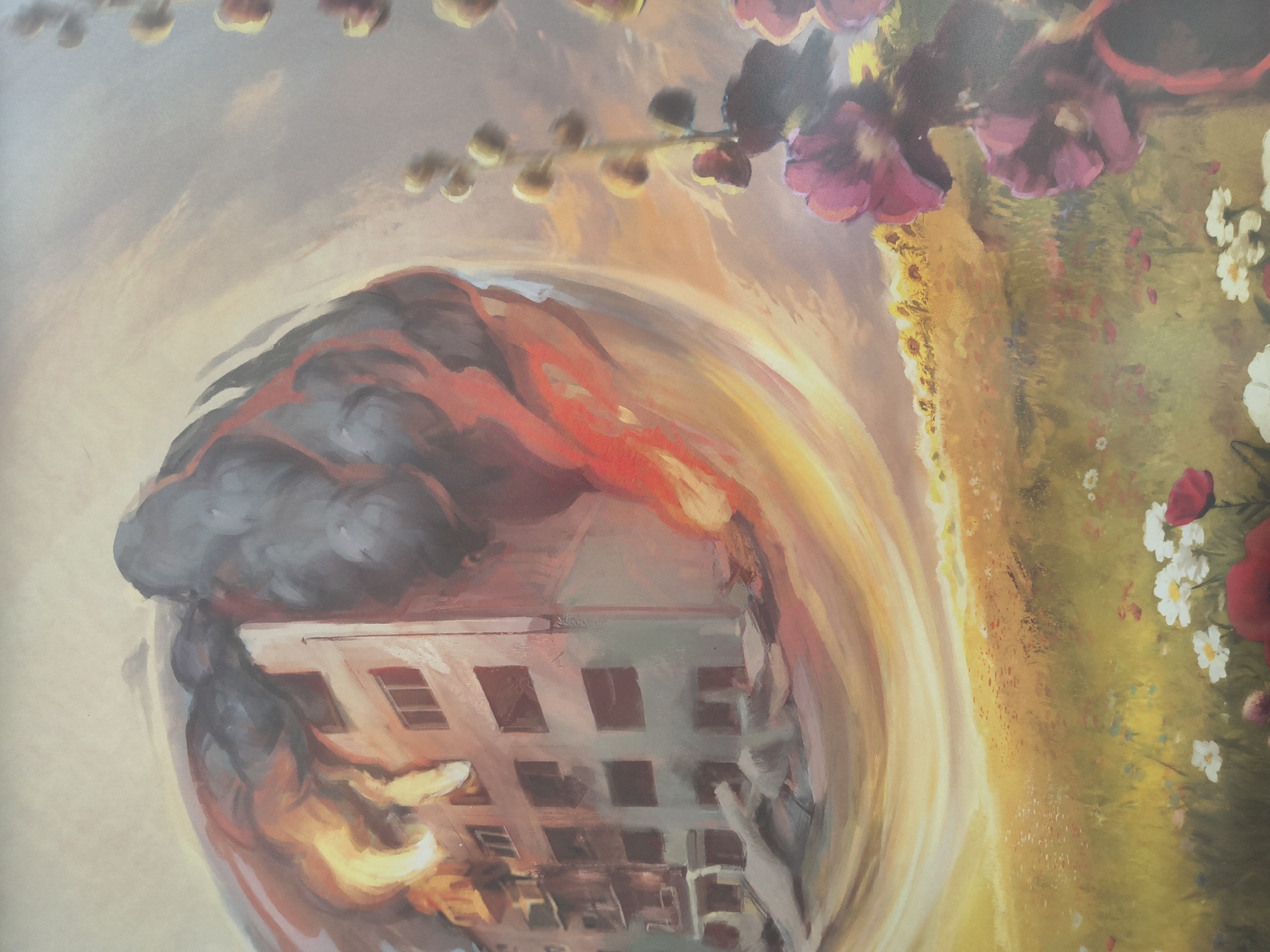 The image is a painting depicting a war-torn apartment building engulfed in flames and smoke, juxtaposed with a peaceful field of flowers. The building, which appears to be in a city setting, is heavily damaged, with debris scattered around its base. The fire is intense, with visible orange and yellow flames and dark, billowing smoke. The overall scene suggests destruction and chaos.
In stark contrast, the lower portion of the painting shows a vibrant meadow filled with various wildflowers, including poppies and daisies, and a field of sunflowers in the background. This idyllic landscape is rendered in warm, sunny tones, creating a powerful juxtaposition with the destruction in the upper part of the image.
While the painting is evocative of the destruction seen in Kyiv, Ukraine, during the ongoing conflict, the specific location within the city is not identifiable from the artwork itself. The scene is a symbolic representation of the devastation of war and the resilience of nature or hope for peace. There are no people or specific identifiable human actions depicted. The environment is clearly divided into a scene of destruction and a scene of natural beauty.