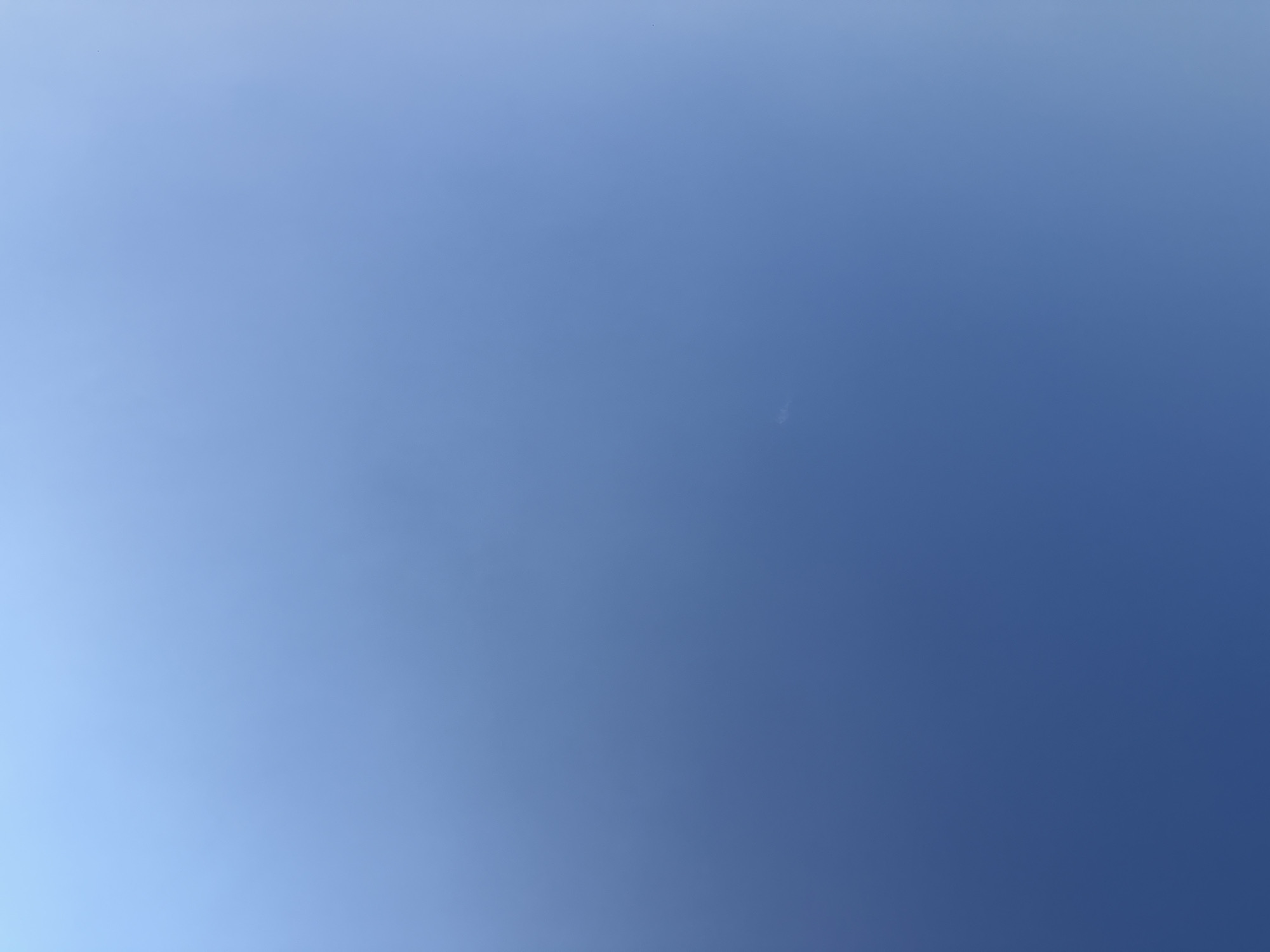The image displays a clear blue sky with a subtle gradient, appearing lighter towards the upper right corner. There are no discernible objects or people in the frame. The scene is devoid of any visible landmarks or environmental features that would indicate a specific location within the city of Ekzarh Antimovo, Bulgaria, or any other geographical setting.