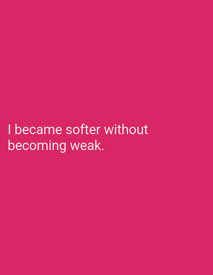 The image is a close-up shot of a plain, vibrant pink background. Two lines of white text are centered on the image. The first line reads "I became softer without". The second line reads "becoming weak." There are no people, objects, or environmental details present in the image. The location of Lassan, Pakistan is not visible in the image.