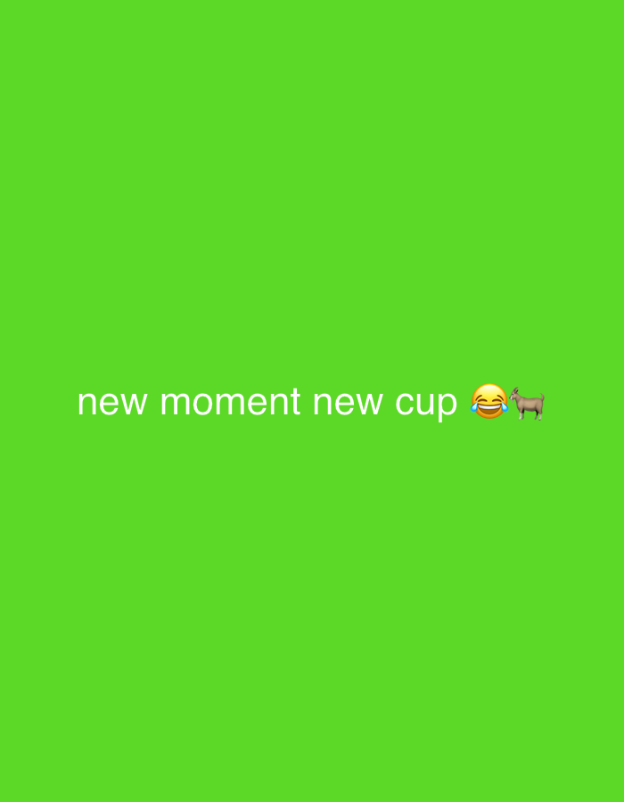 The image is a digital graphic with a bright green background. White text is centered on the lower half of the image, reading "new moment new cup". To the right of the text, there are two emojis: a laughing face with tears and a goat. The image does not contain any elements that would suggest a specific location in London or any other city.