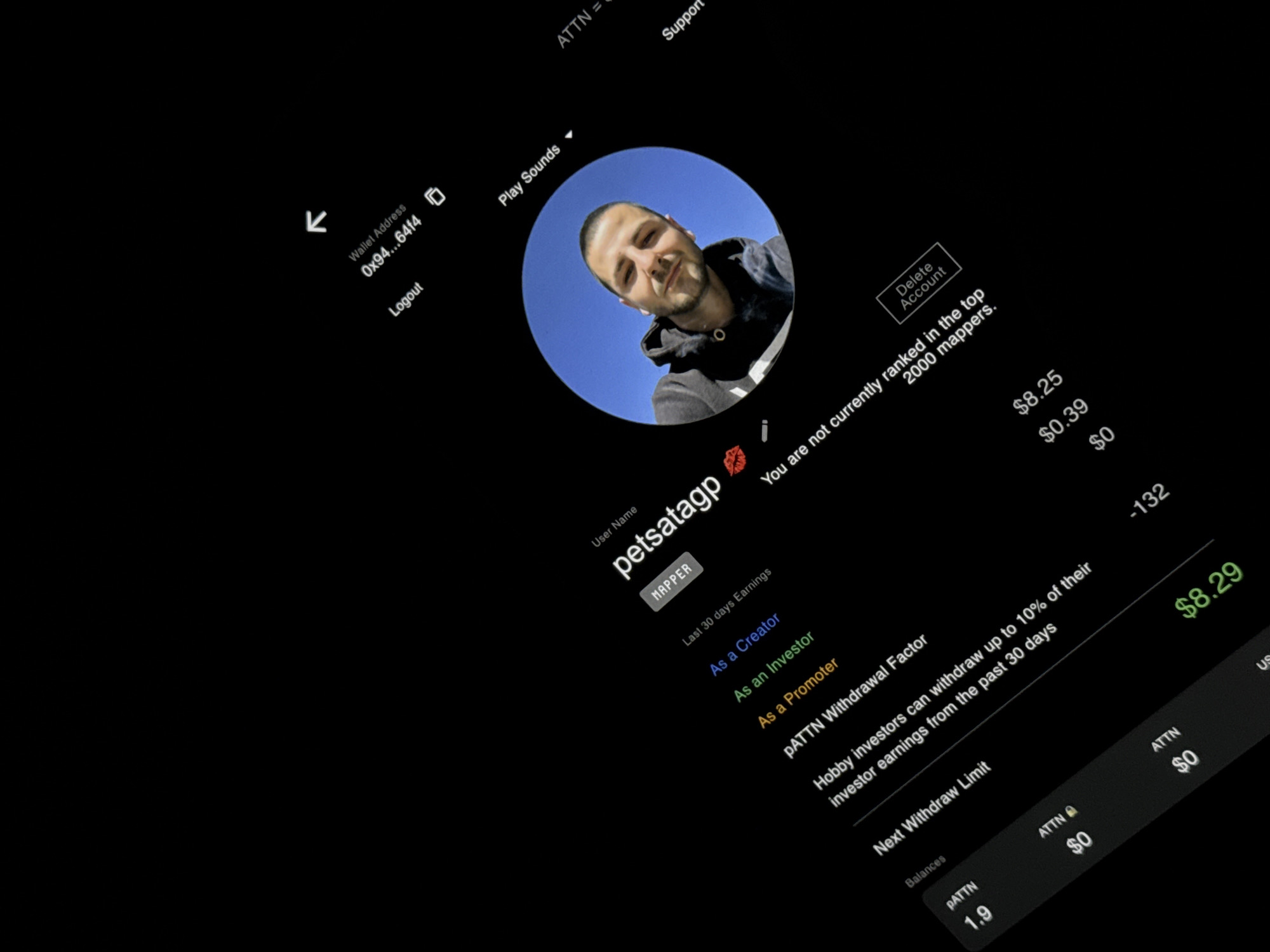 The image shows a screenshot of a user profile named "petsatagp" on an application, possibly related to cryptocurrency or earnings. The user is a "MAPPER." The profile picture features a man with short dark hair and a slight smile, wearing a hoodie. The wallet address is "0x94...64f4." There's information about the user's last 30 days earnings, including earnings as a Creator ($8.25), Investor ($0.39), and Promoter ($0). The "PATTN Withdrawal Factor" is -132, with a withdrawal limit of $8.29. The user's ATTN balance is 1.9, equating to $0. The user is not currently ranked in the top 2000 mappers. There are also options to play sounds, logout, delete the account, and access support. The image does not reference or depict the city of Veliko Tarnovo, Bulgaria.