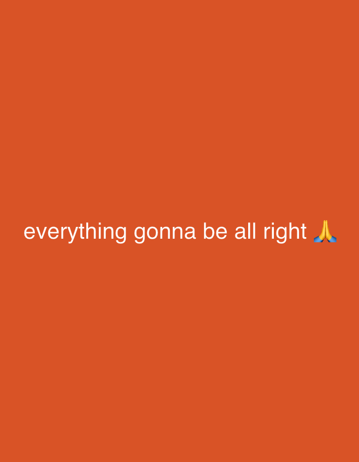 The image displays a solid, dark orange background. Centered horizontally, white lowercase text reads "everything gonna be all right." Immediately to the right of the text, a yellow-skinned praying hands emoji (🙏) is depicted. No discernible people, specific subjects, objects beyond text and an emoji, actions, interactions, or environmental details of a physical location are present. The scene is static and devoid of any visual indicators for a specific city or geographical location such as Tanger, Morocco.