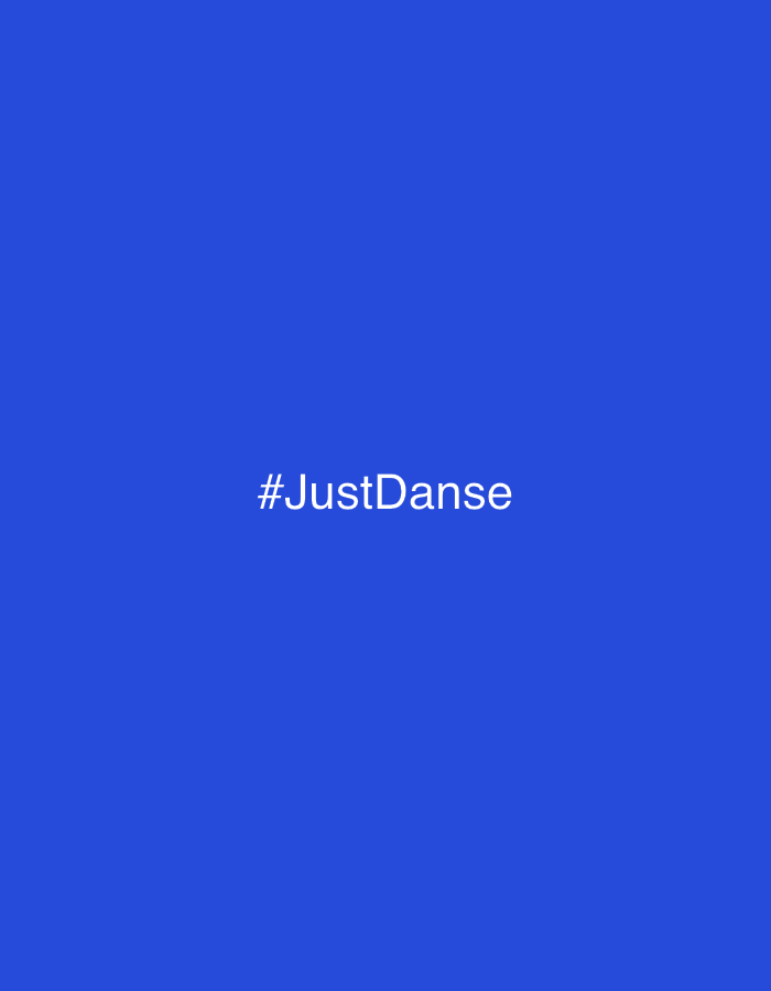 The image features a solid royal blue background. Centered on this background, in white sans-serif typeface, is the text "#JustDanse". No other discernible subjects, objects, people, actions, interactions, or environmental details are present. The image provides no visual information regarding a specific geographical location.