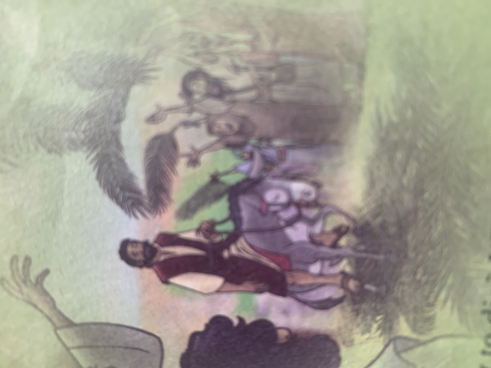 The image depicts an illustration of a religious procession. A man with a beard and dark hair is riding a grey donkey. He is wearing a white shirt and a dark red vest. The donkey is adorned with pink fabric on its head. The man is holding the reins of the donkey. In the background, a crowd of people are raising their hands, seemingly in celebration or reverence. Some figures in the crowd are holding palm fronds, suggesting a Palm Sunday theme. To the left of the image, a large hand with outstretched fingers is visible, possibly part of a larger figure or symbolic representation. The environment appears to be outdoors with a pale green sky and a muted landscape. There are hints of foliage in the foreground and background. The image has a soft focus and appears to be from a book or story. There is no information in the image or context provided that allows for the identification of the location as Jauro Yinu, Nigeria.