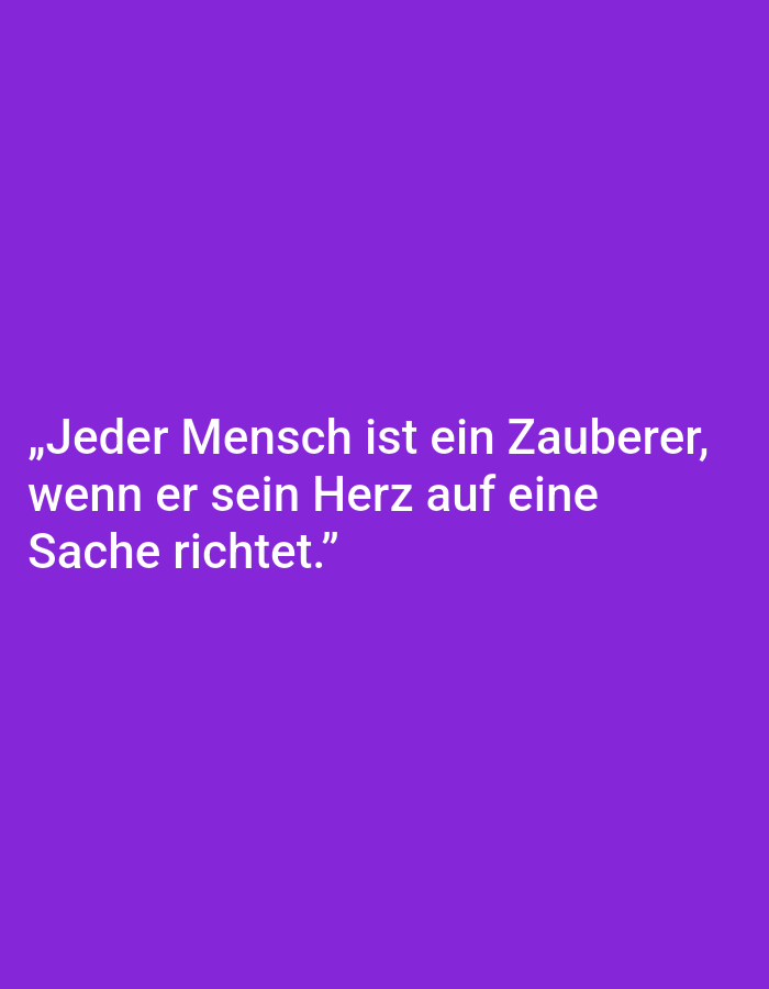 The image is a photograph with a solid purple background. White text in a sans-serif font is overlaid on the image. The text is a quote in German: "„Jeder Mensch ist ein Zauberer, wenn er sein Herz auf eine Sache richtet." This translates to "Every person is a magician when they focus their heart on one thing." There are no people, objects, or scene details visible other than the text and background. The context provided indicates the location is Kępno, Poland, but this is not visually represented in the image. The image appears to be a graphic designed to display the quote.
