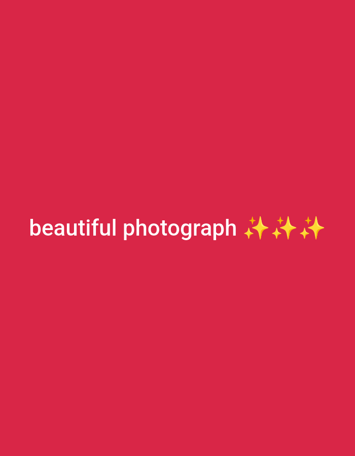 The image is a red rectangle with the white text "beautiful photograph" on the bottom left. There are four yellow star symbols to the right of the text.