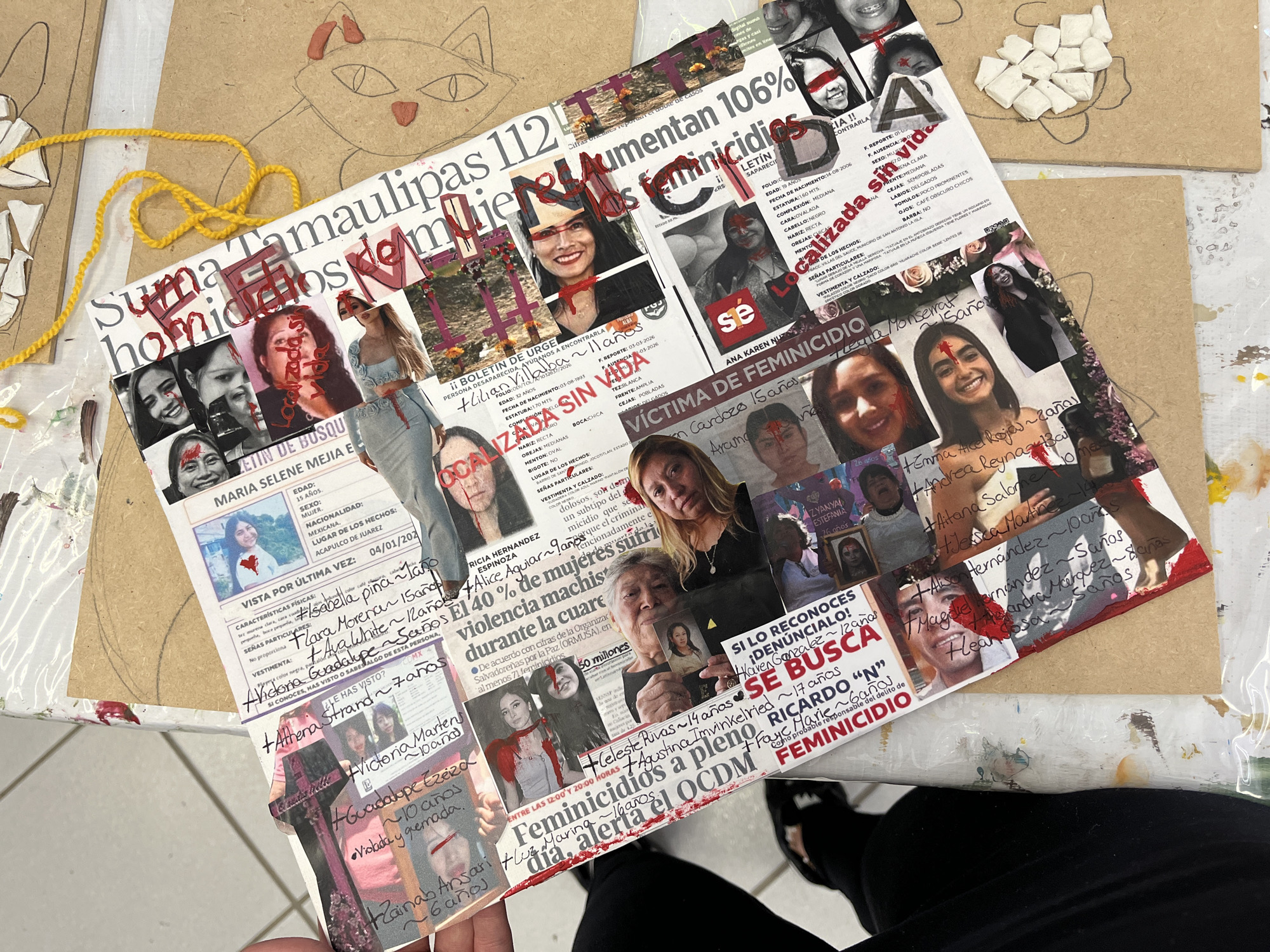 The image shows a collage of newspaper clippings, photos, and handwritten notes predominantly focused on the topic of femicides. Faces of women and girls, some with red markings resembling blood, are visible across the collage. Headlines include phrases like "Feminicidios a pleno" and "Aumentan 106% Feminicidios." Individual cases with names, ages, and descriptions of missing or deceased women are documented. The overall tone of the image is somber, indicating a focus on violence against women. The location is not identifiable as Puebla, Mexico. The subjects are femicides. The objects are newspaper clippings, photos, handwritten notes, a collage.