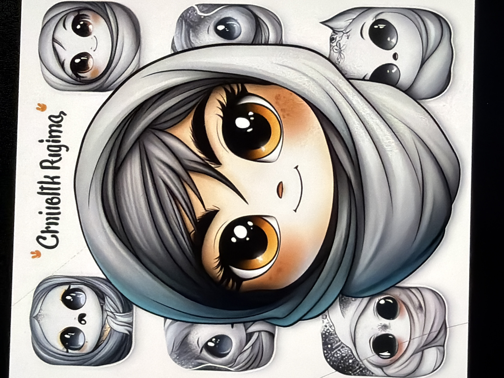 The image displays a stylized cartoon drawing featuring a central figure and six smaller surrounding figures on a white background. The central figure is a character with large, round, bright orange eyes, dark eyebrows, dark hair visible under a teal and grey head covering, and a small, subtle smile. The character's cheeks show a faint orange blush.
Positioned around the central figure are six smaller, individual cartoon characters, each enclosed in a rounded square shape, reminiscent of application icons or stickers. These smaller characters are primarily grey-toned and also wear head coverings.
- The top-left character has large, dark, slightly sad-looking eyes, a tiny nose, and a light grey head covering.
- The top-right character has large, smiling brown eyes, a small smile, and a light grey head covering.
- The mid-left character, partially obscured by the central figure, has large, dark eyes and a grey head covering.
- The mid-right character, also partially obscured, has large, dark eyes and a grey head covering.
- The bottom-left character has large, dark eyes, rosy cheeks, a tiny nose, and a grey head covering with speckled, shiny details at the top.
- The bottom-right character has large, dark eyes, a tiny nose, a slight smile, pointed ears, and a grey head covering with a floral detail on top.
Above the central figure, the words "Crniieltk Rigima," are written in a stylized, cursive font. Two small orange symbols, resembling rabbit ears or "V" shapes, flank the text. The background is uniformly white.
The image contains no visual elements, landmarks, or contextual clues that would allow for the identification of a specific geographical location, including the city of Kyiv, Ukraine, or any other real-world environment.