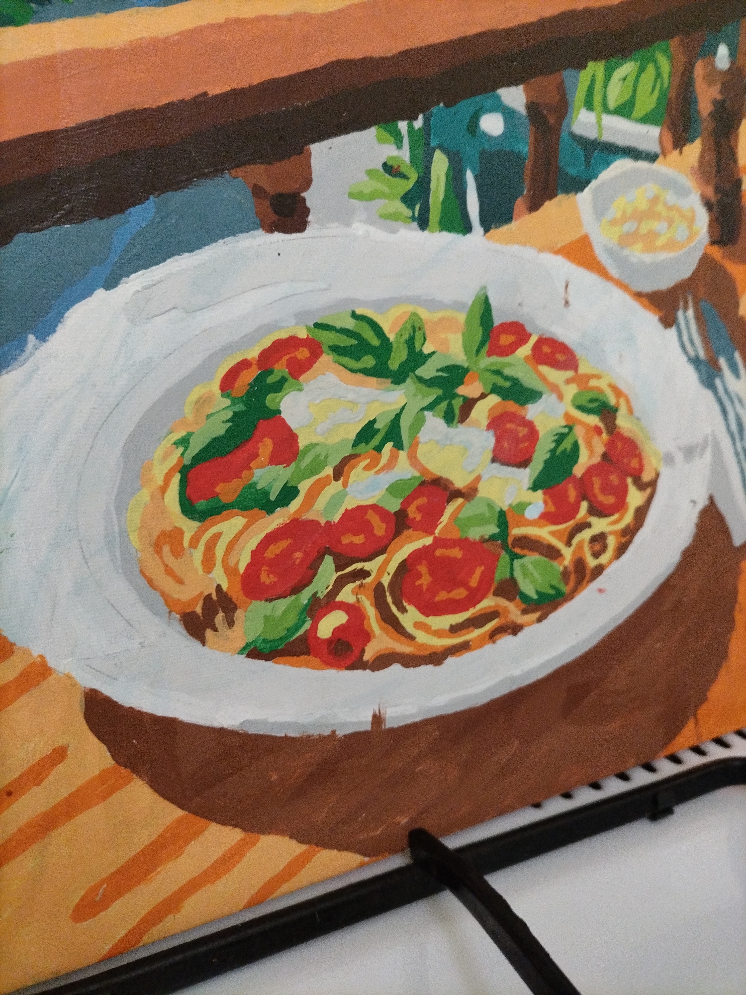 The painting depicts a close-up view of a plate of spaghetti with cherry tomatoes and basil, presented on a table with a striped orange tablecloth. In the background, there's a blurry depiction of greenery and a small white bowl containing a yellow substance, possibly cheese or a sauce. The style of the painting is impressionistic, with broad brushstrokes and vibrant colors. No specific location in a city is discernible.