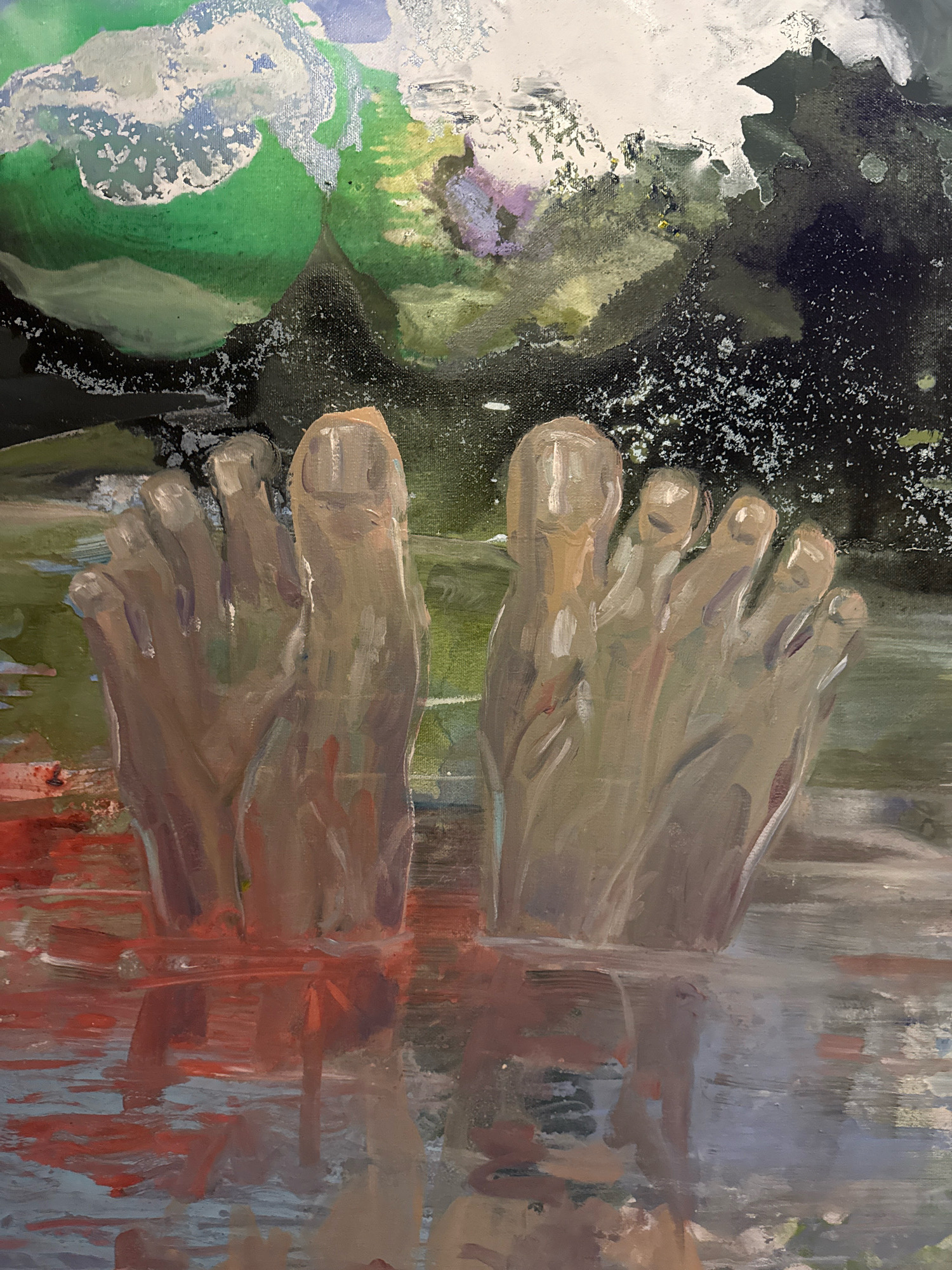 The image is an oil painting depicting a pair of bare feet submerged in murky, reddish-brown water. The background is abstract, with washes of green, white, blue, and dark grey suggesting a natural landscape. The painting style is impressionistic, with visible brushstrokes and a focus on light and color rather than precise detail. The feet are rendered in muted tones of brown and beige, with highlights and shadows indicating their form. The water is painted with broad, horizontal strokes, creating a sense of depth and reflection. There are no visible people other than the feet. The image does not provide any information about the city of Da Lat, Vietnam.