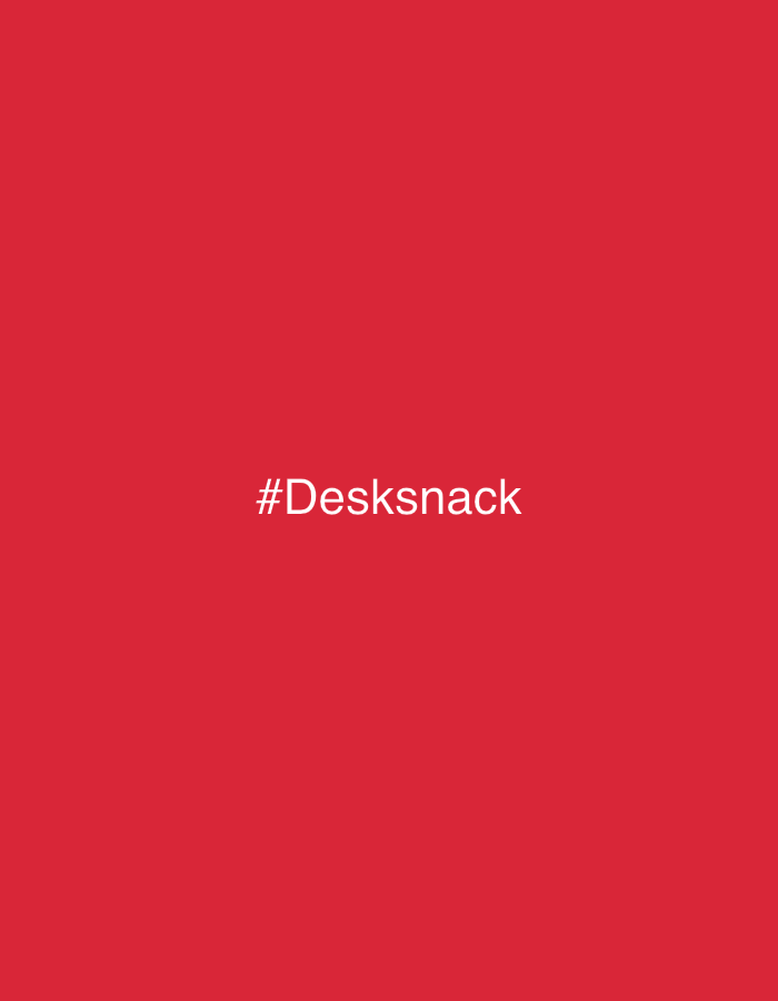 The image displays a solid red background. Centered horizontally and vertically in the frame is the white text "#Desksnack". No individuals, tangible subjects, physical objects, actions, or interactions are visible. The image does not depict any identifiable physical environment or specific location within the city of London, United Kingdom.