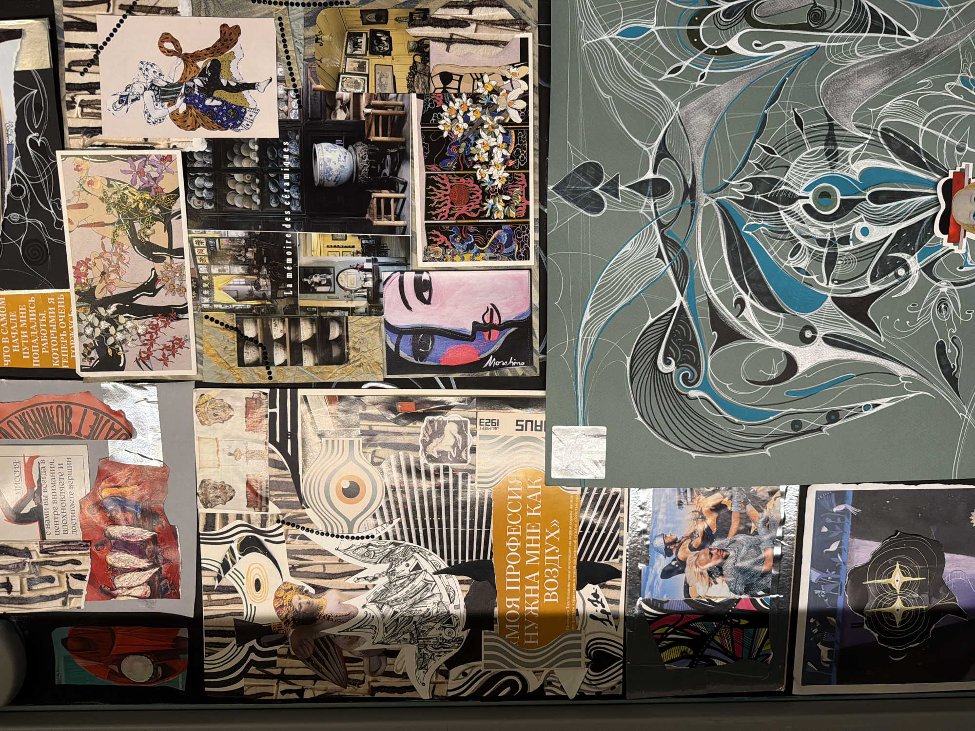 This is a close-up shot of a collage artwork. The collage incorporates a variety of images and texts arranged on a gray background. The images include illustrations of figures, floral designs, interior scenes, eye motifs, abstract patterns, and photographs. Text elements are present in Russian and other languages. A "Moschino" logo is visible. The text includes phrases like "MY PROFESSION NEEDS ME LIKE AIR", "MISSION", and "I AM VERY PROUD OF THE WORKS THAT COME TO ME IN THE BEGINNING OF THE ROAD". The collage is layered, with elements overlapping and juxtaposed. The photograph does not depict any specific location or individuals in Moscow, Russia.