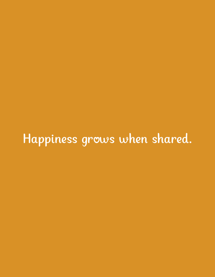 The image is a vertical, plain orange background with white text centered on it. The text reads: "Happiness grows when shared." The font is a whimsical, handwritten style, and the letter 'o' in "grows" is depicted as a small heart. There are no people, objects, or scenes visible in the image, nor any clues about the time of day, weather, or specific location. The overall mood conveyed by the simple design and the message is one of positivity and warmth.