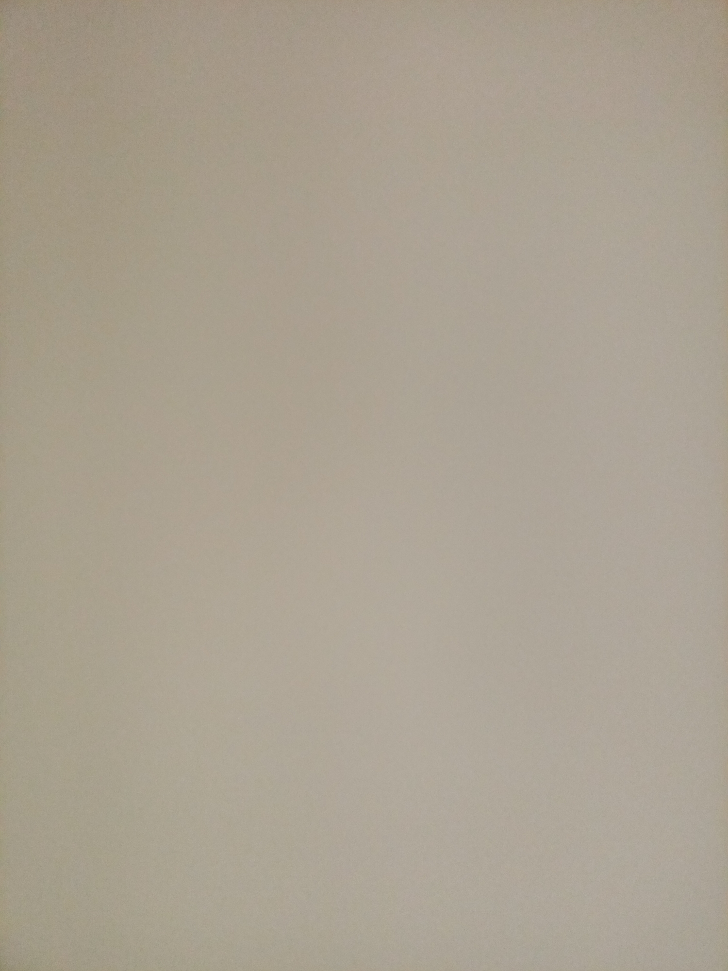 This is a flat, evenly lit, neutral-toned background image with no discernible subjects, objects, actions, or interactions. It appears to be a plain wall or surface. The image does not contain any visual information that would allow for the determination of a location in Rostov-on-Don, Russia, or any other geographical context.