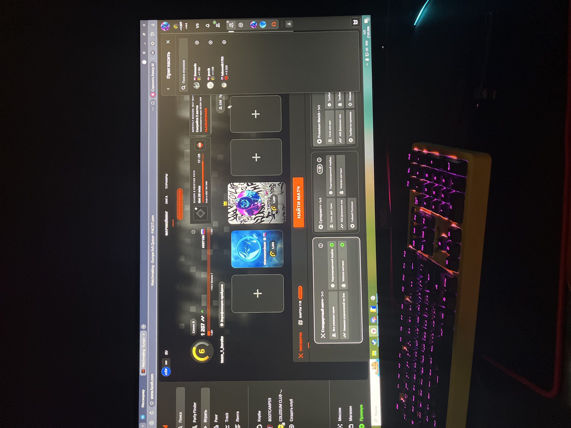 The image shows a computer screen displaying the FACEIT platform interface for the game Counter-Strike: Global Offensive (CS:GO). The interface is open to the matchmaking screen, with options for queuing into different game modes and inviting players. The user's rank is shown as Level 6. A keyboard with purple lighting is visible in the bottom right corner of the image. The Windows taskbar at the bottom shows various icons for programs and the time, 1:25 PM on May 27, 2026. The location in the city of Chaikovsky, Russia cannot be verified from this image.