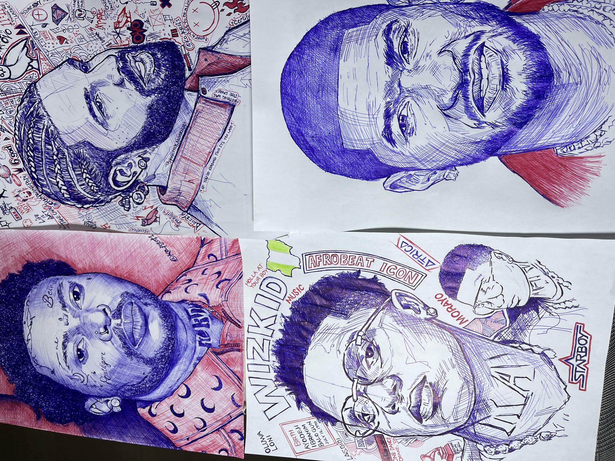 The image displays four detailed pen-and-ink portraits of musicians, arranged in a two-by-two grid. The portraits are rendered in blue and red ink, with varying degrees of shading and cross-hatching. The top left features a close-up of a man with numerous facial tattoos and a patterned shirt. The top right shows a man with braided hair and a beard, surrounded by various doodles and text, including an owl symbol. The bottom left depicts Wizkid, identified by text and a Nigerian flag graphic, wearing glasses and a chain. A smaller portrait of another person is included to his right. The bottom right is a close-up of a man with a beard and a red collar, with a beaded necklace visible. The overall presentation suggests an artistic composition rather than a candid photograph. There is no discernible information within the image or its context to indicate any specific location in the city of Jos, Nigeria.