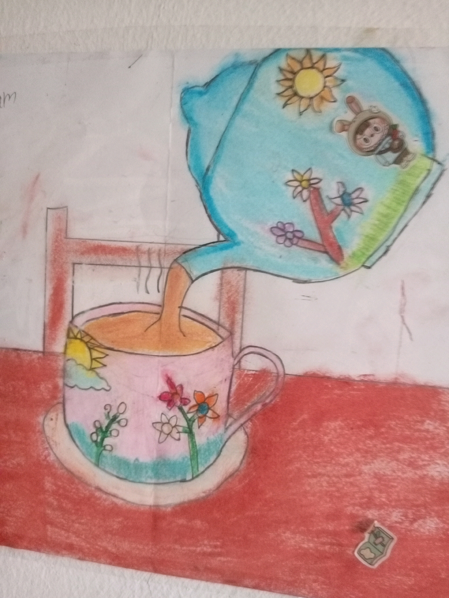 The image is a colored pencil drawing depicting a surreal scene. A blue teapot is shown pouring a brown liquid into a pink mug. The teapot and mug are decorated with various elements, including a sun, clouds, flowers, and a character that appears to be a rabbit in a costume. The drawing is on a piece of paper that is taped to a wall, and there is a red surface below the mug and teapot that appears to be a table. There is also a red chair in the background. The overall impression is whimsical and fantastical. There is no discernible location in Batam, Indonesia, or any other specific location.