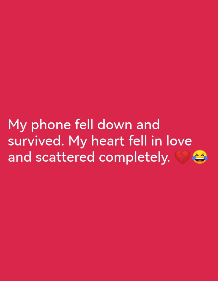 A dark pink background features white text that reads "My phone fell down and survived. My heart fell in love and scattered completely." To the right of the text, there is a broken heart emoji and a laughing face emoji.