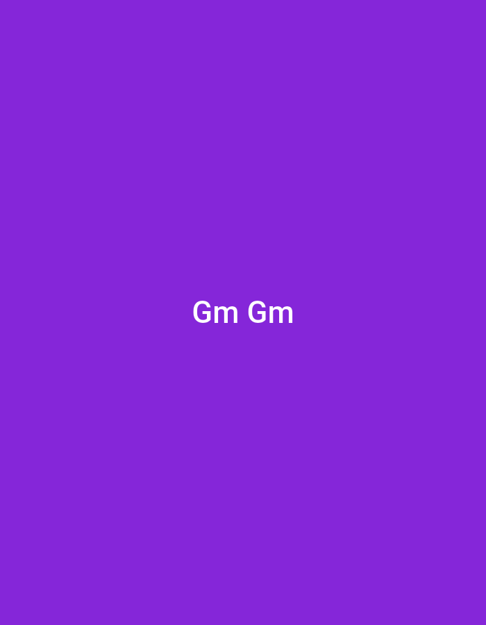 This image is a digital graphic featuring a solid, uniform purple background. Centrally positioned on this purple field are the characters "Gm Gm" rendered in white, sans-serif typeface. No other elements, subjects, objects, or discernible environment are present. The image provides no information about a specific geographical location; therefore, the location is unknown and unidentifiable from the visual content.