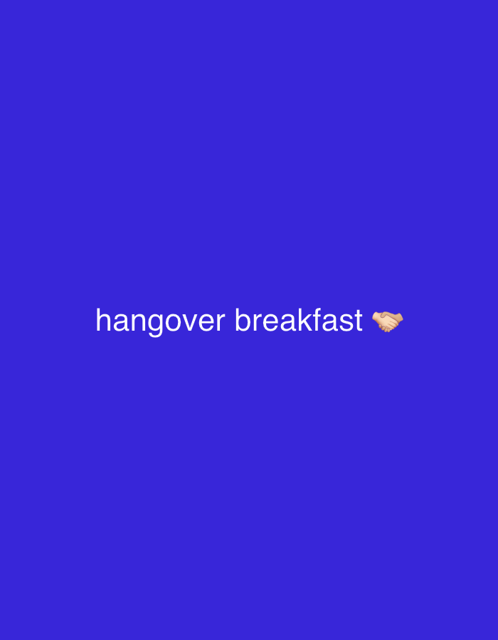 The image displays a digital graphic with a solid royal blue background. White sans-serif text, "hangover breakfast", is centered horizontally in the lower half of the frame. A handshake emoji, rendered in brown and beige tones, appears to the immediate right of the text. No individuals, physical objects, or actions are depicted within the graphic. The environment is solely the solid blue digital canvas. This image is situated within the context of the city of Tel-Aviv, Israel.