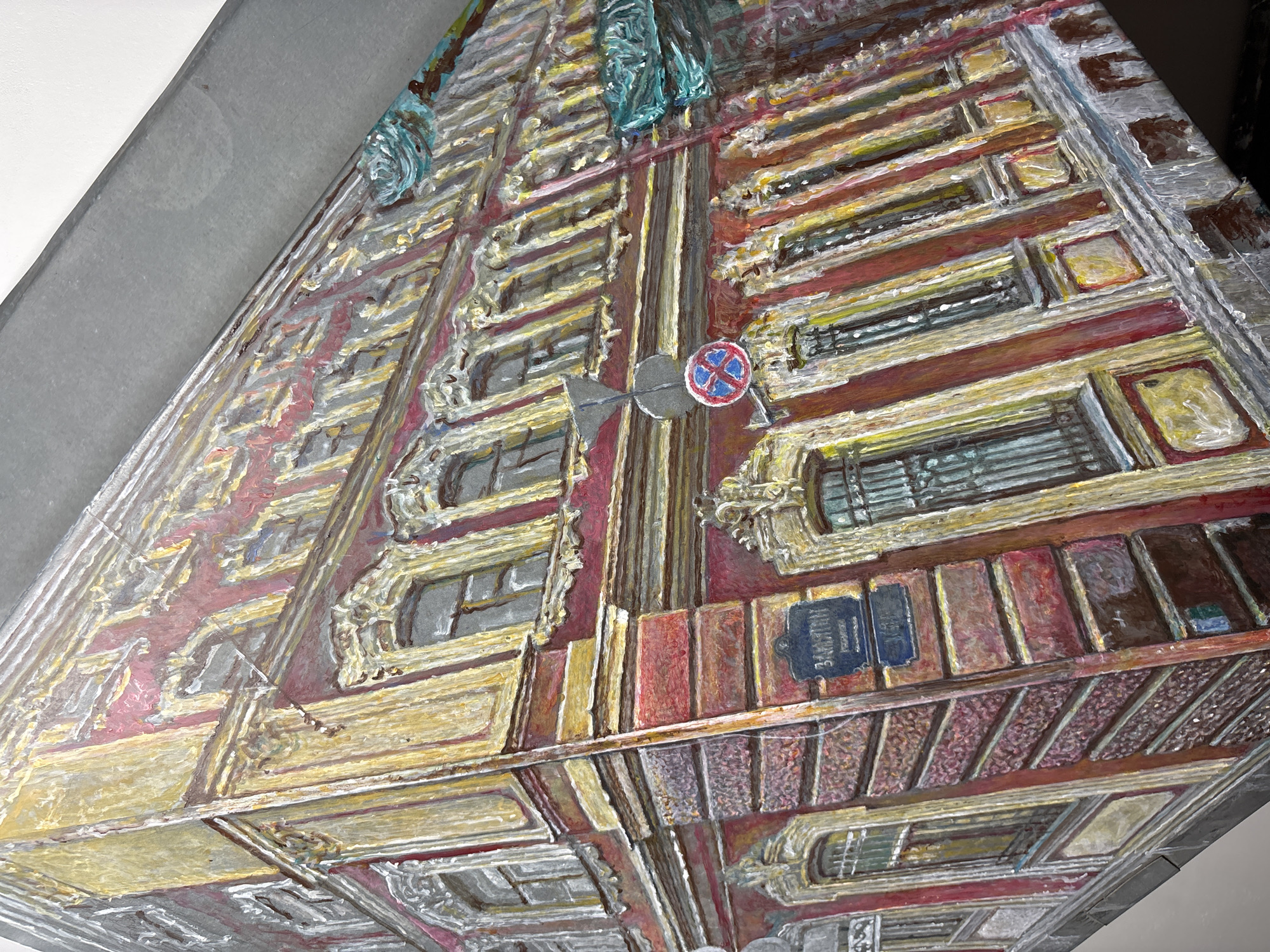 This is a painting depicting the facade of a building in Saint Petersburg, Russia. The building features red and yellow architectural details, ornate window frames, and multiple windows. A street sign with Cyrillic lettering is visible on the building's corner, and a traffic sign with a red circle and a diagonal blue line, indicating no stopping, is mounted on a pole. The painting style is expressive, with visible brushstrokes and a textured surface. The overall impression is a close-up, angled view of the building's exterior, emphasizing its architectural features and urban setting.