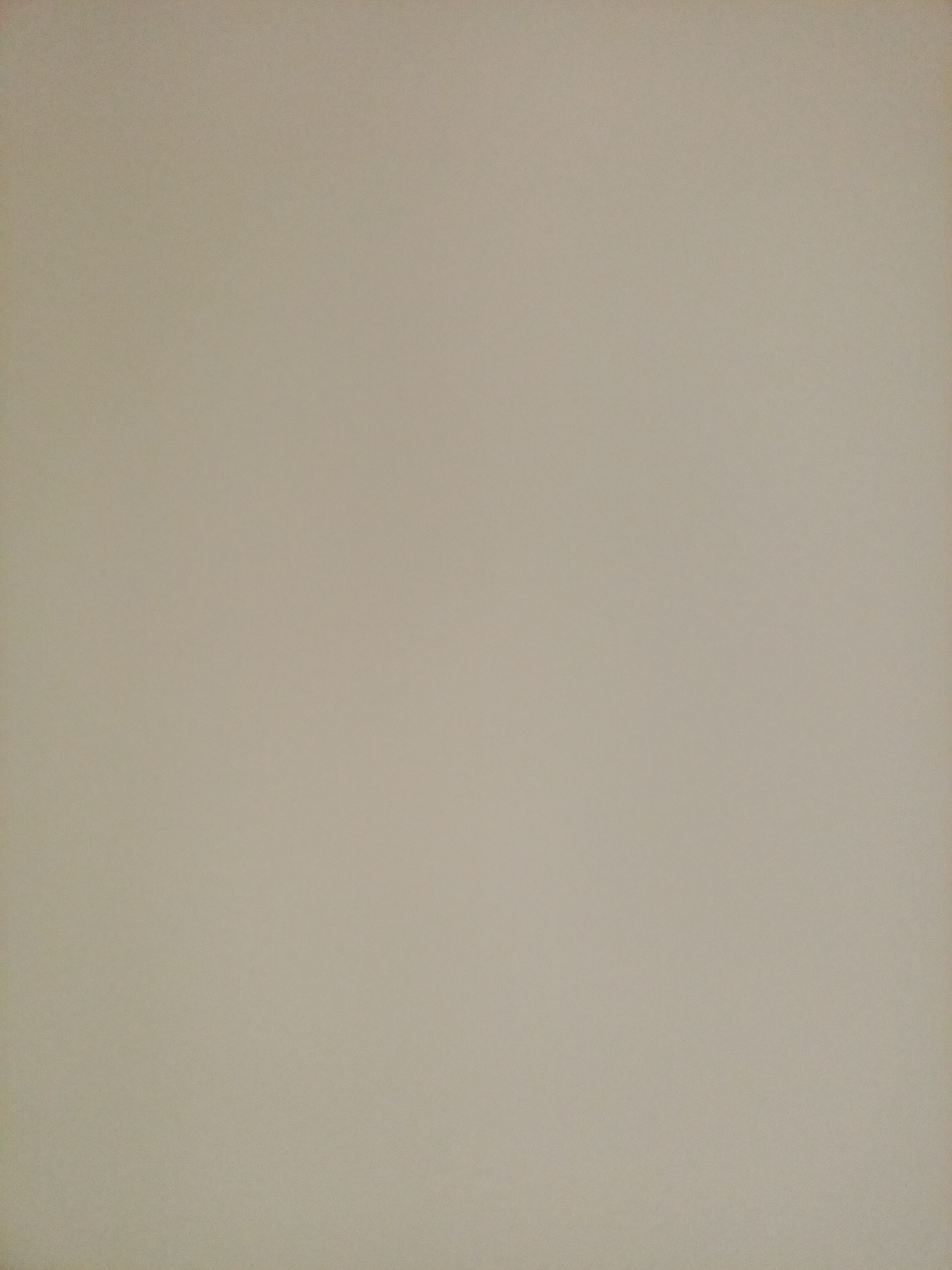 The image is a plain, overhead view of a neutral-colored surface, likely a wall or a backdrop. There are no discernible objects, people, or any other details within the frame. The lighting is even, with no shadows or highlights. The color is a muted, light beige or taupe. The image provides no information about its location in Rostov-on-Don, Russia, or any other contextual details.