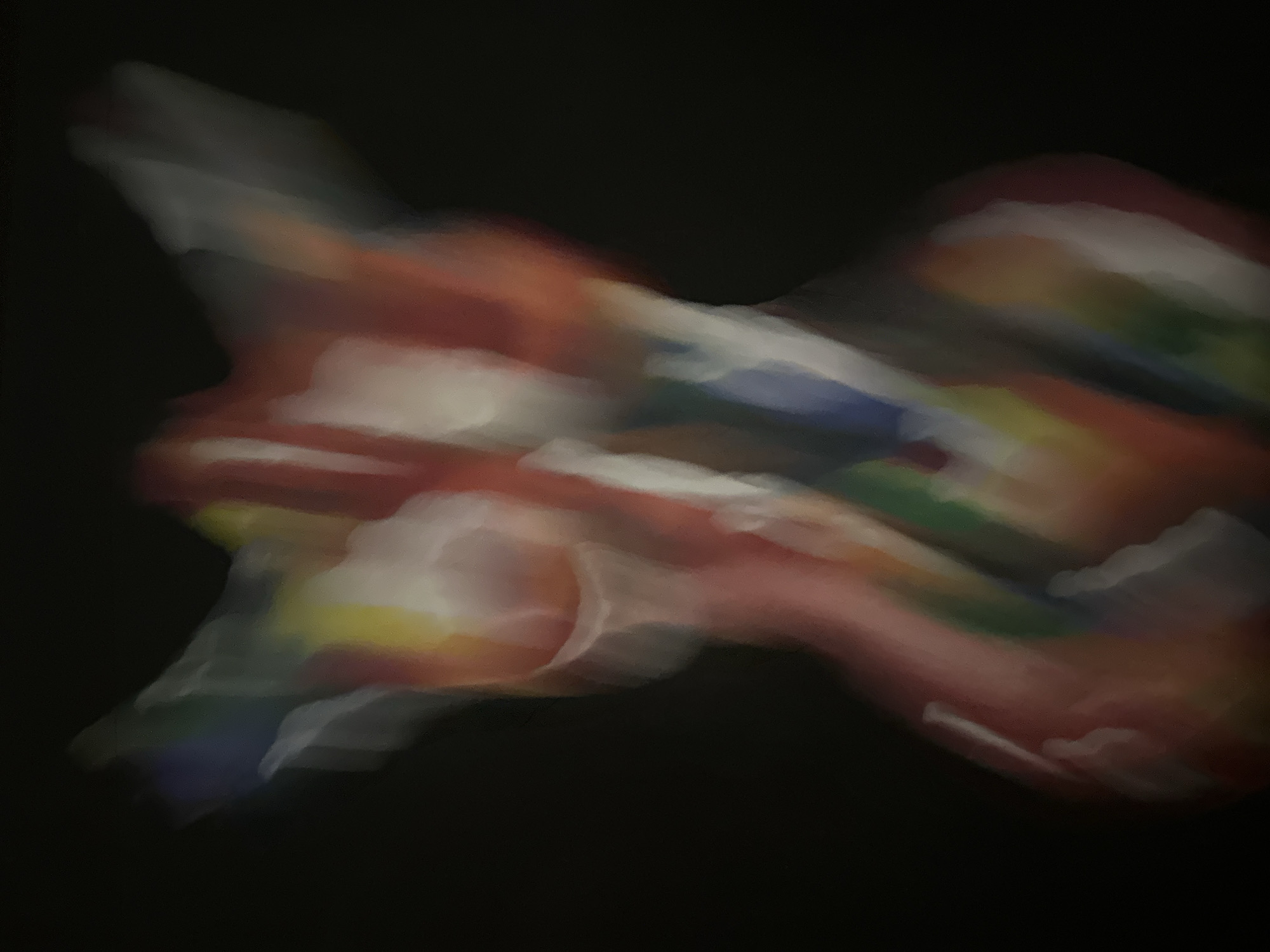 An abstract, blurred image of a human torso is presented against a black background. The torso is rendered with vibrant, vertical streaks of color, including red, white, blue, yellow, and green. The colors appear to be applied in a way that suggests movement or a fluid medium, creating an impressionistic effect. The lighting is soft and diffused, with highlights and shadows that emphasize the curvature of the form. The image is likely a photograph or a digital artwork that uses motion blur or a similar technique to achieve its abstract quality. The location is not specified in the image.