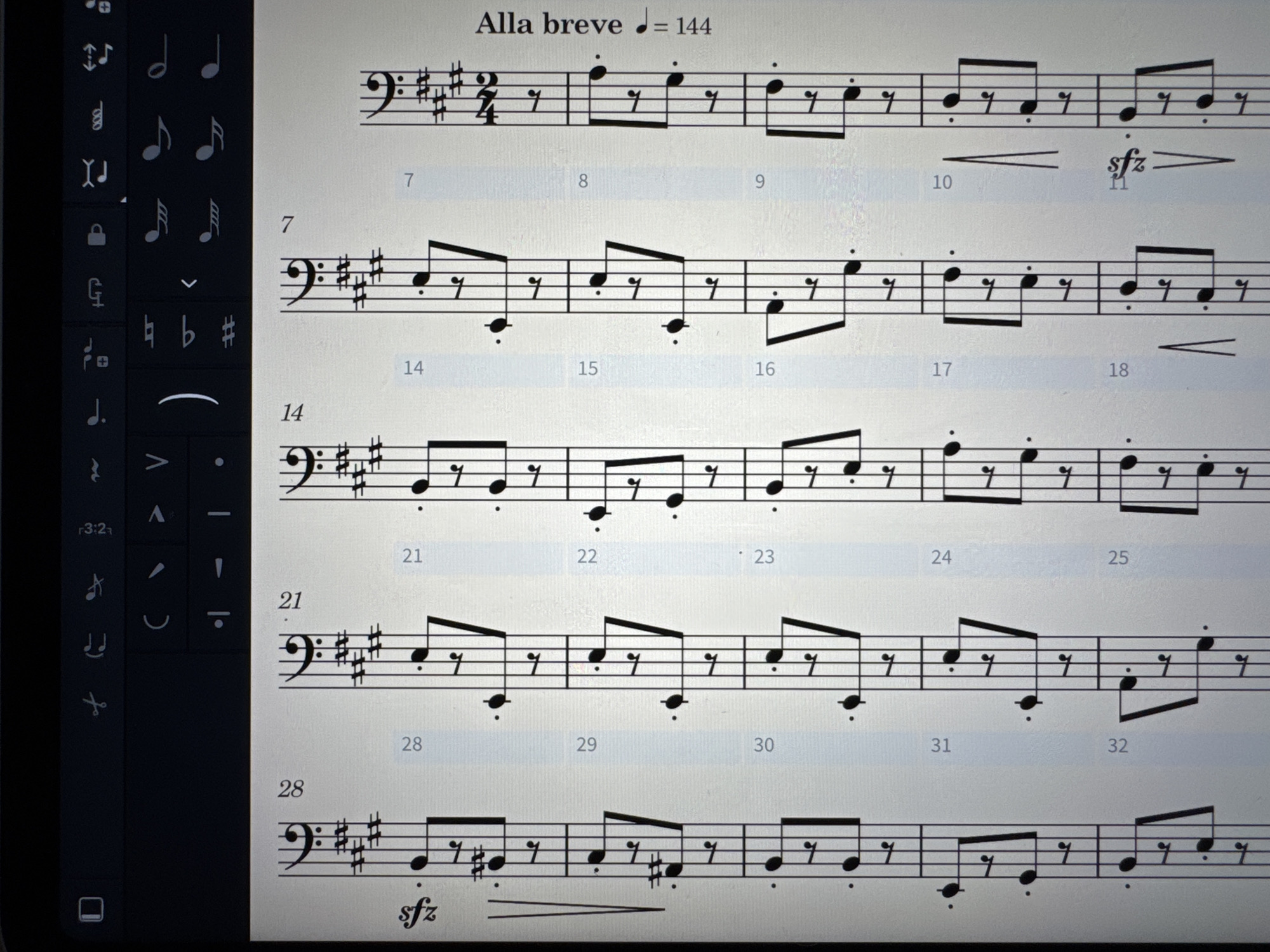 The image shows a page of musical score displayed on a screen. The title "Alla breve" and a tempo marking "J=144" appear at the top. The music is written in bass clef and features a time signature of 2/4. The score is numbered by measure, starting with 7 and ending with 32. The music consists primarily of quarter notes and eighth notes. Some measures contain crescendo markings and sforzando markings. A sidebar containing music notation tools is visible on the left side of the screen. The scene appears to be located indoors, but the city and specific location are not identifiable from the given image.
