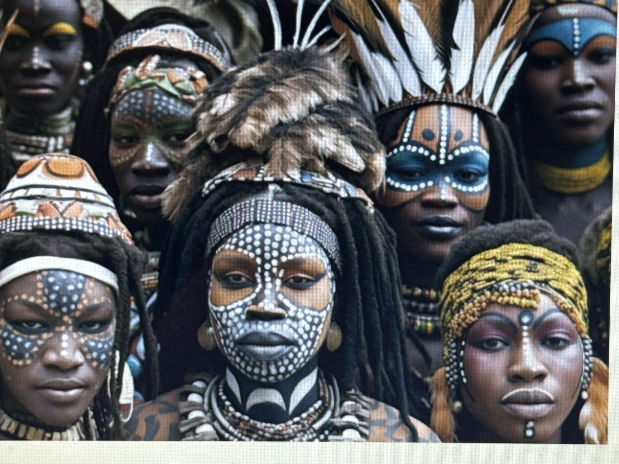 This media file shows a close-up of a group of people adorned with traditional face paint, elaborate headdresses, and ornate jewelry. The subjects are likely participating in a cultural ceremony or festival. The face paint is intricate and diverse, with patterns of dots, lines, and shapes in white, blue, and orange. Headdresses range from feather arrangements to feathered and fur decorations. The individuals are wearing layered necklaces and bracelets made of beads, shells, and other natural materials. The expressions on their faces are largely serious or stoic, suggesting a solemn or ritualistic atmosphere. The lighting appears to be natural, possibly indicating daytime, with no specific weather conditions discernible. The background is blurred, making it difficult to determine the exact setting, but it seems to be an outdoor environment with muted earthy tones. There is no visible text in the image.