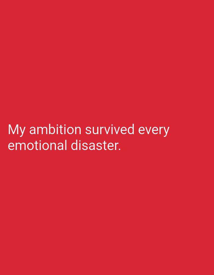 The image is a close-up of text on a red background. The text reads "My ambition survived every emotional disaster." The text is white and appears to be in a sans-serif font. There is no discernible location in the city of Lassan, Pakistan, as the image contains only text and a solid red background.