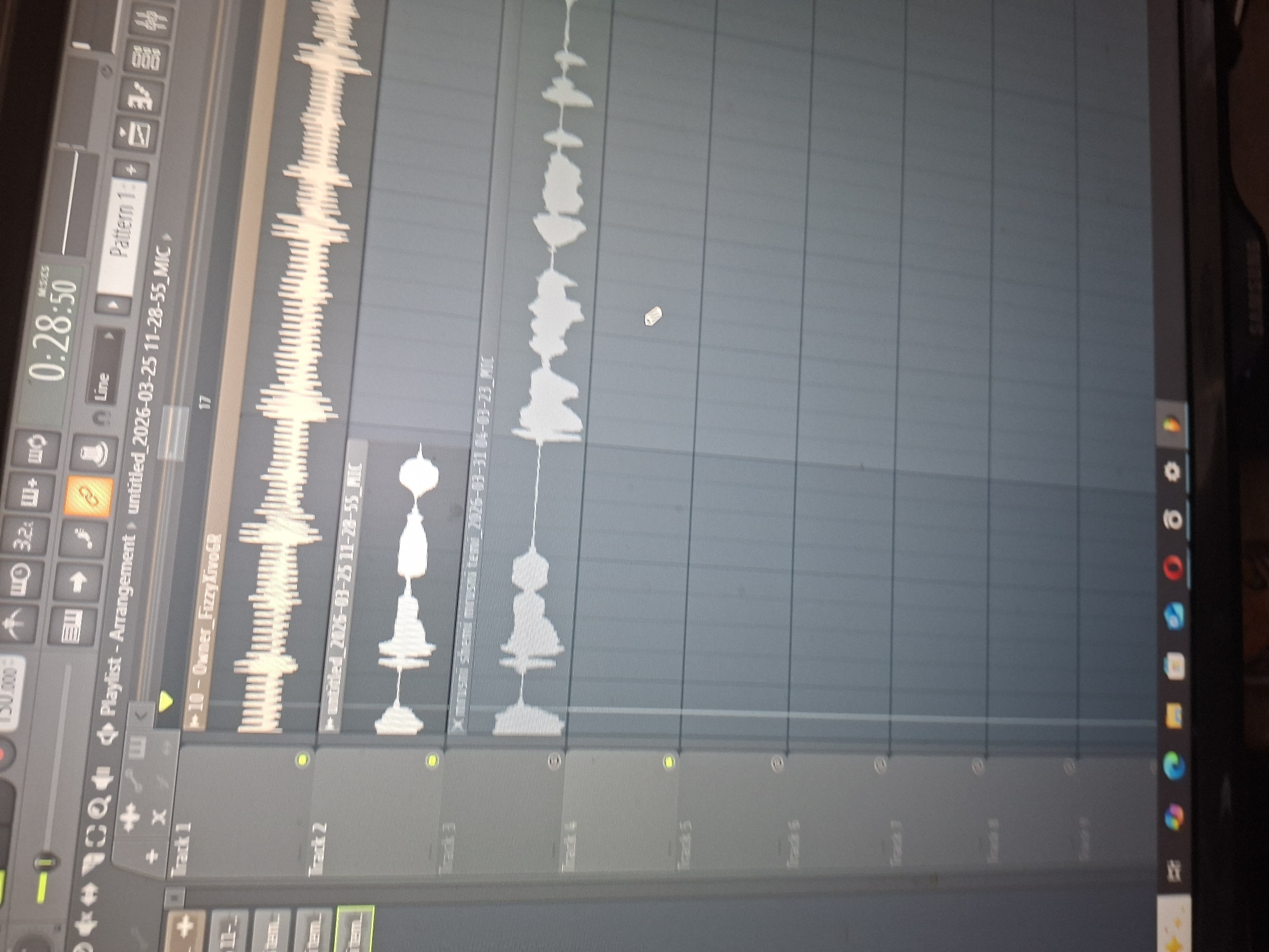 The image shows a computer screen displaying the digital audio workstation FL Studio. The arrangement view is open, showing several tracks with audio waveforms present. The tracks are labelled "Track 1," "Track 2," "Track 3," and so on. Track 1 contains a clip labelled "10-Owner_Fizzy XivoGR." The project is named "untitled_2026-03-25 11-28-55_MIC." The timeline shows a time of 0:28:50, and the tempo is set to 150 BPM. The image provides no information to determine the location in Plovdiv, Bulgaria.