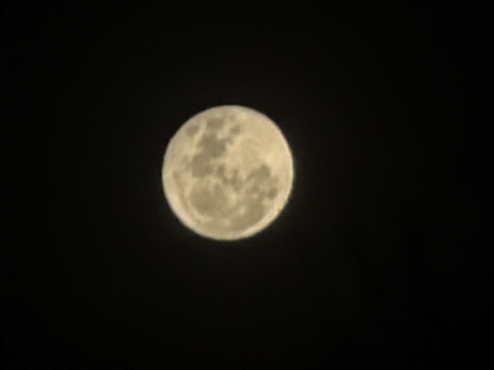 A full moon, showing craters and surface details, is centered against a black background. There is no discernible location information visible within this image, including in the city of Tartat, Russia.