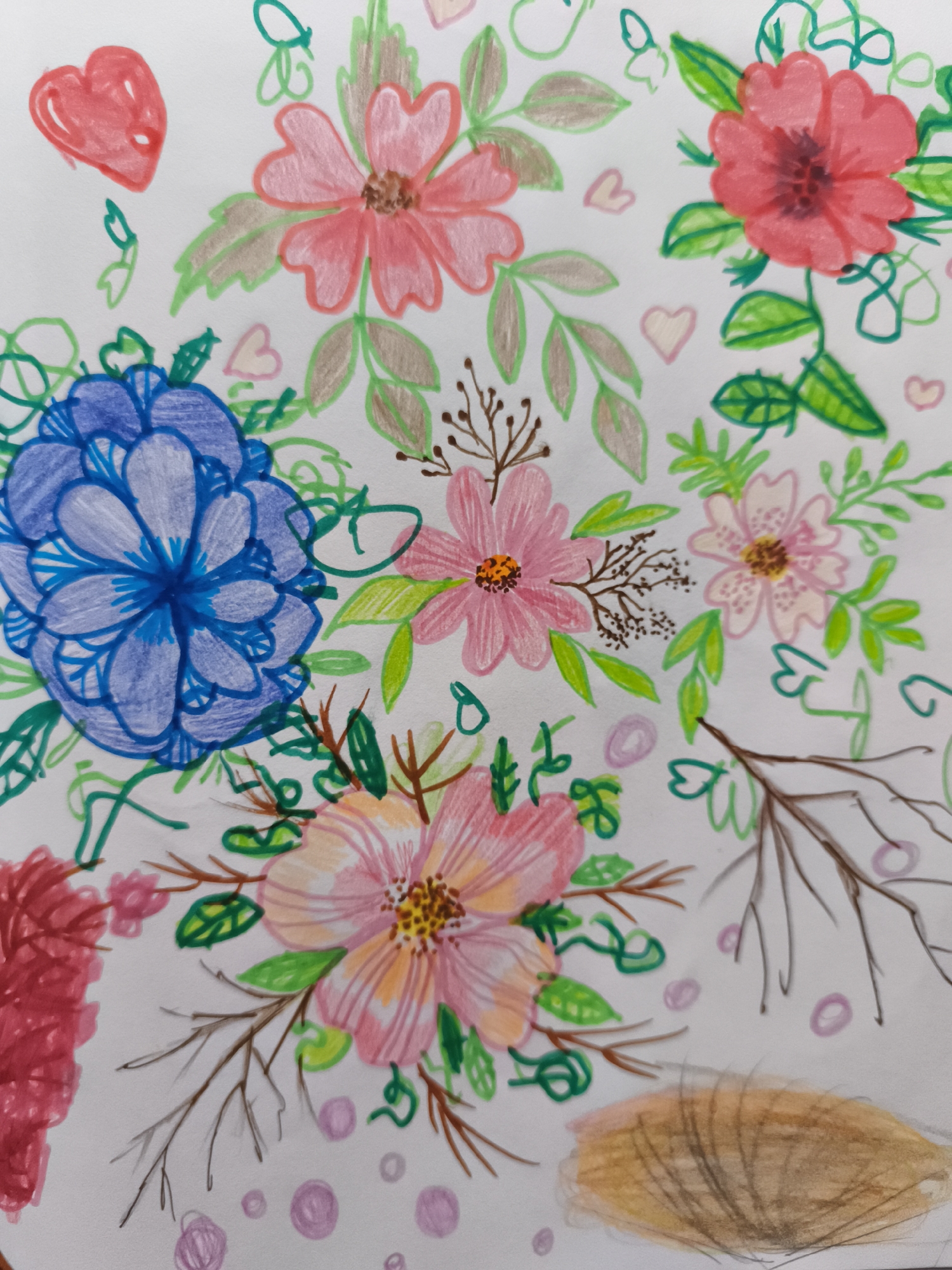 The image is a close-up, overhead shot of a drawing on white paper. The drawing features a variety of colorful flowers, leaves, and hearts, rendered in what appears to be colored pencil or crayon. The floral elements are depicted in shades of red, pink, blue, and orange, with green leaves and brown stems and branches. Some of the flowers are simple and stylized, while others are more detailed with visible petals and stamens. Small pink and purple circles are scattered across the paper, some appearing as dots and others as outlines. In the bottom right corner, there is a shaded, oval-shaped area that resembles a furry texture, possibly indicating a patch of fur or a stylized representation of an animal. The artwork is whimsical and appears to be a decorative illustration rather than a realistic depiction of a scene. There is no discernible location in the city of Saint-Denis, France, or any people, actions, or interactions.