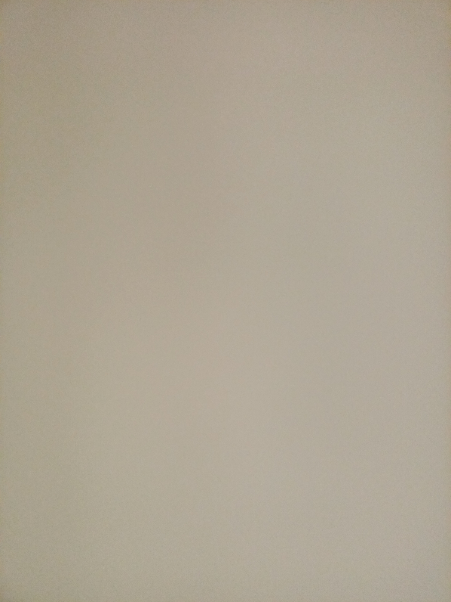 The image is a flat, uniform, light beige surface with no discernible objects, people, or actions. It appears to be a close-up, top-down view of a plain wall or a sheet of paper. There are no visual cues to indicate any specific location within the city of Rostov-on-Don, Russia, or any other geographical context. The lighting is even and casts no shadows.