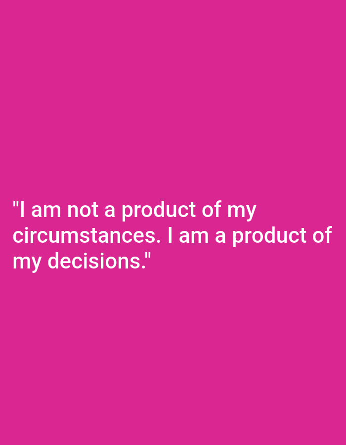 The image is a photograph with a bright pink background and white text. The text reads: "I am not a product of my circumstances. I am a product of my decisions." There are no people, subjects, objects, actions, interactions, or environmental details visible in the image besides the text and background. The location of Nowa Wieś Książęca, Poland, is not depicted or suggested by the image.
