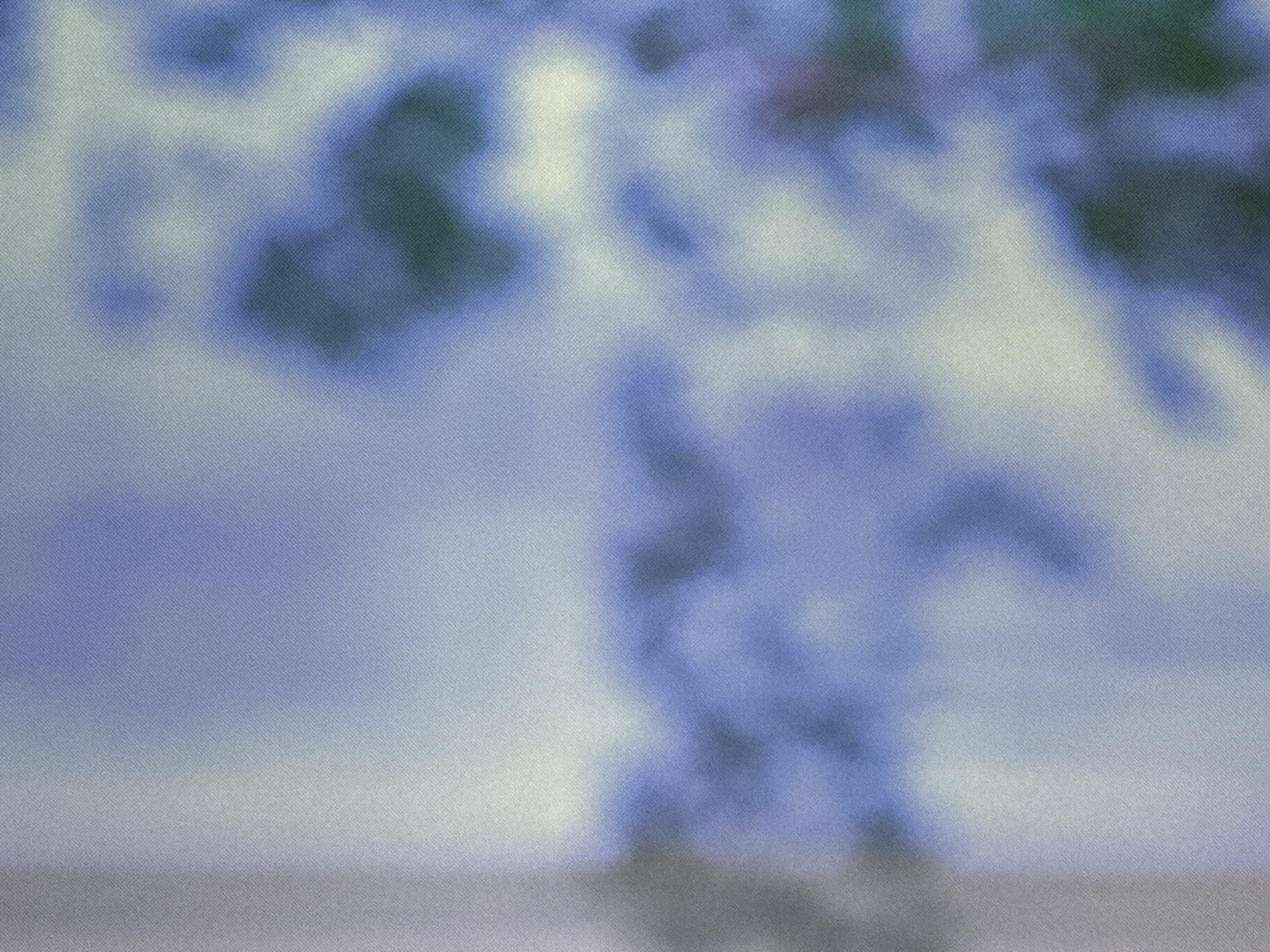 The image is an abstract, blurry photograph dominated by shades of blue and white, with hints of dark green. There are no discernible subjects, objects, actions, or interactions visible. The texture suggests a grainy photographic print, possibly digital noise or film grain. The overall impression is one of soft, diffused light and indistinct forms. There is no visual information in the image that allows for the determination of its location, including whether it is in Saratov, Russia, or any other specific place.